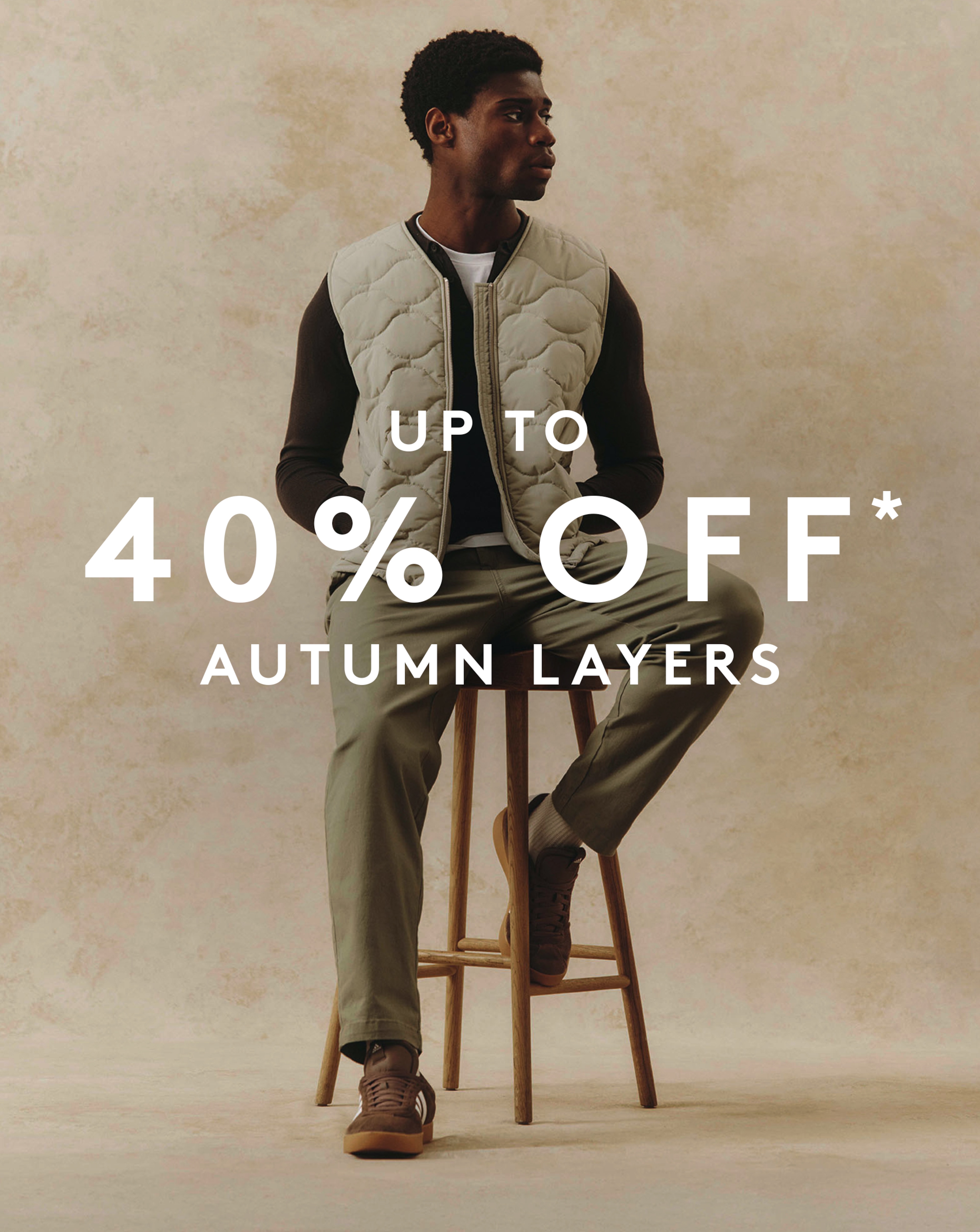 Up to 40% OFF* Autumn Layers. Model wears Onion Quilt Zip Through Gilet with Green Trousers.