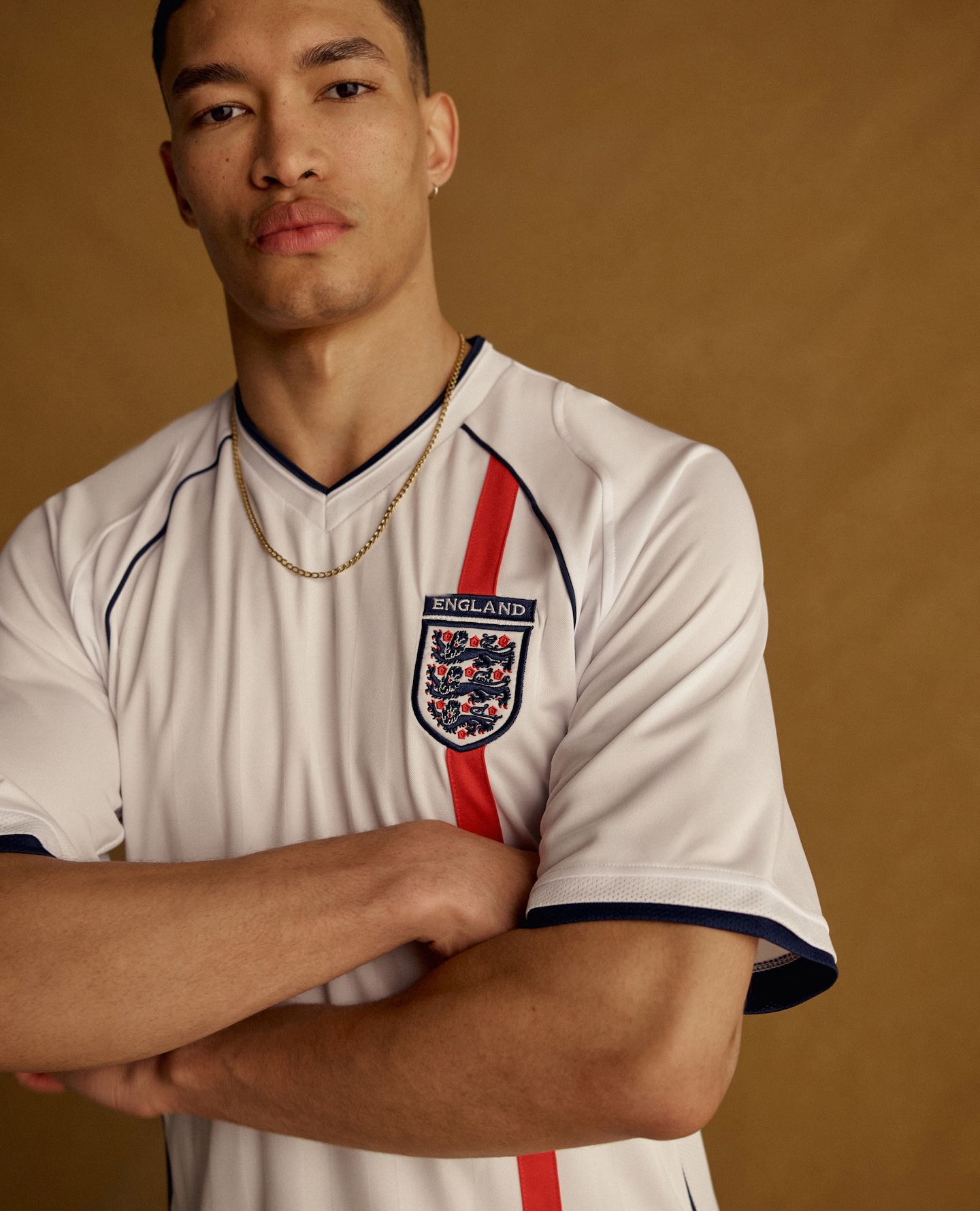Model wears white England football shirt