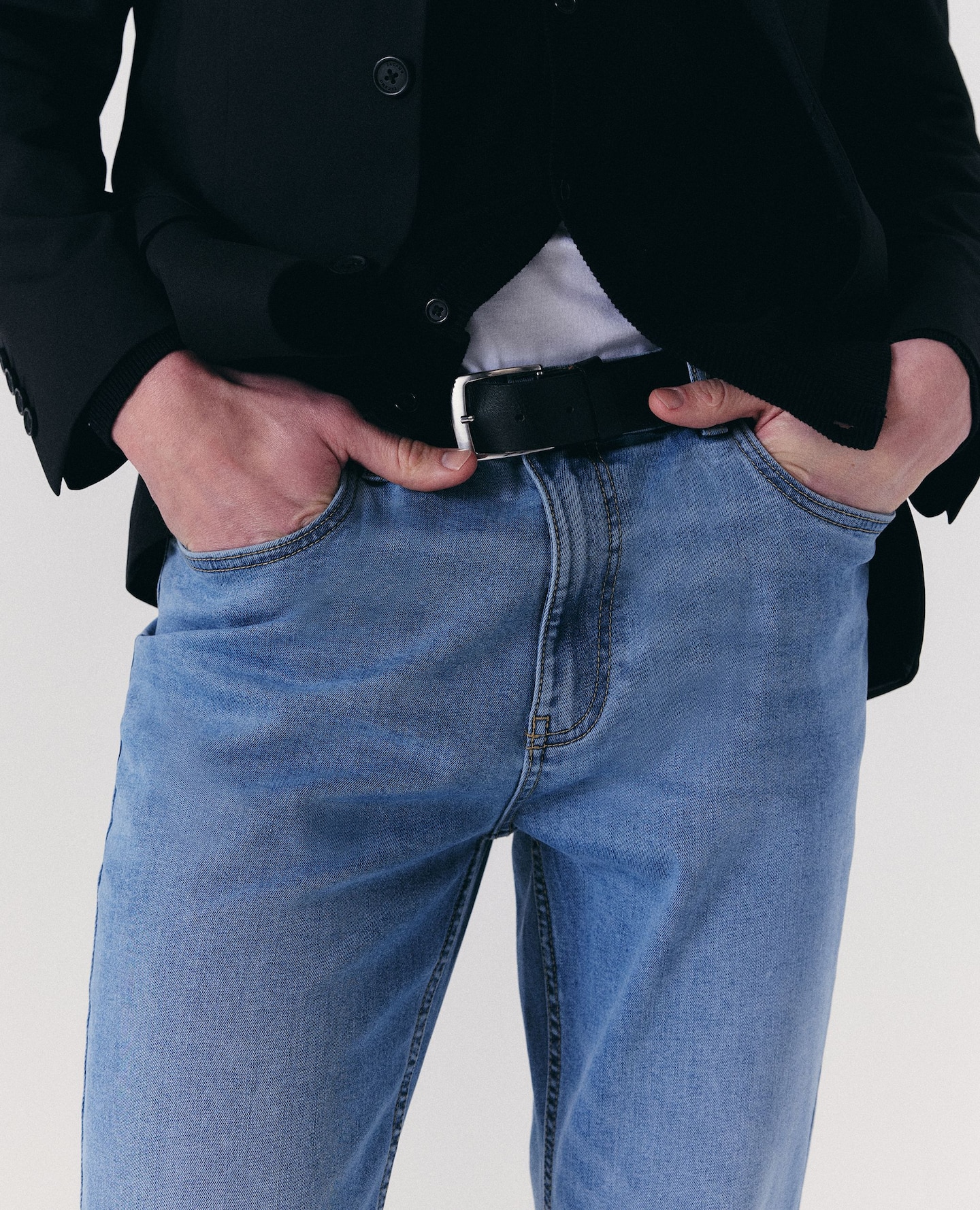 Model wears slim fit jeans