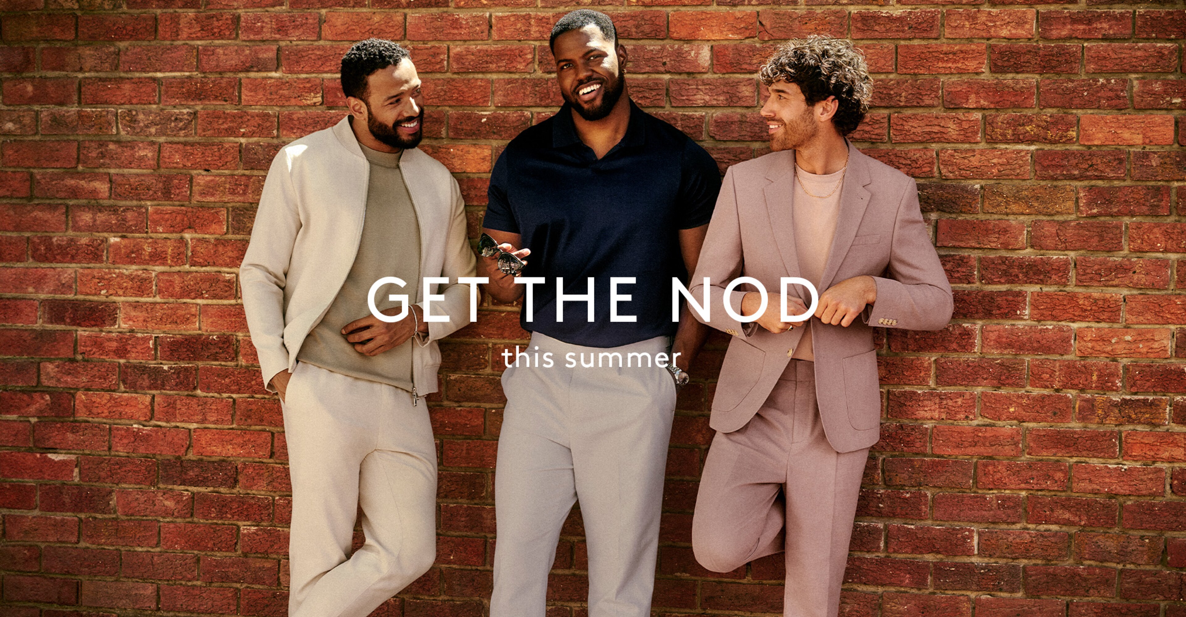 Three models leaning against a brick wall with the campaign strapline Get the Nod