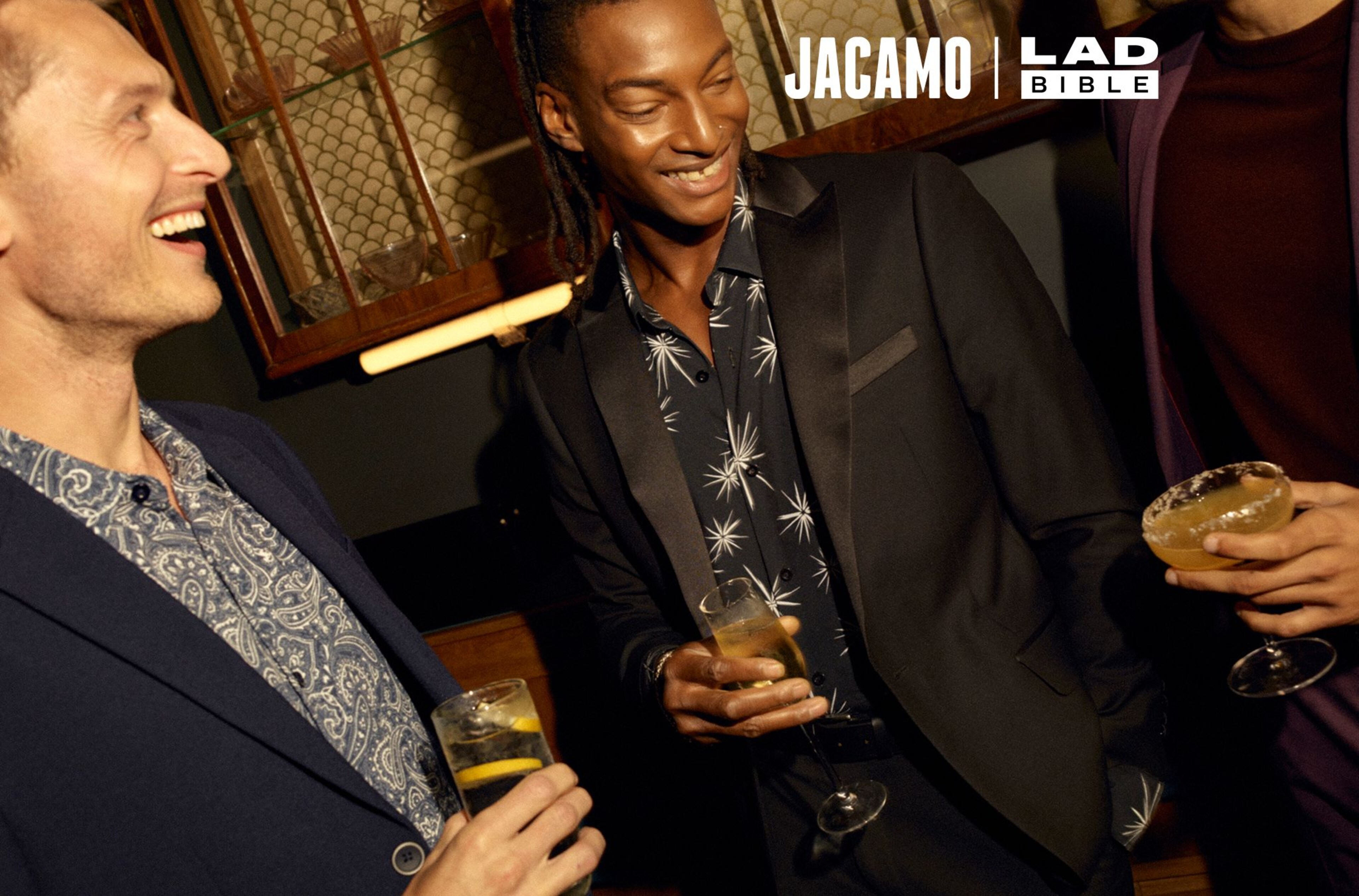 Models dressed smartly in a bar with drinks. Ladbible.