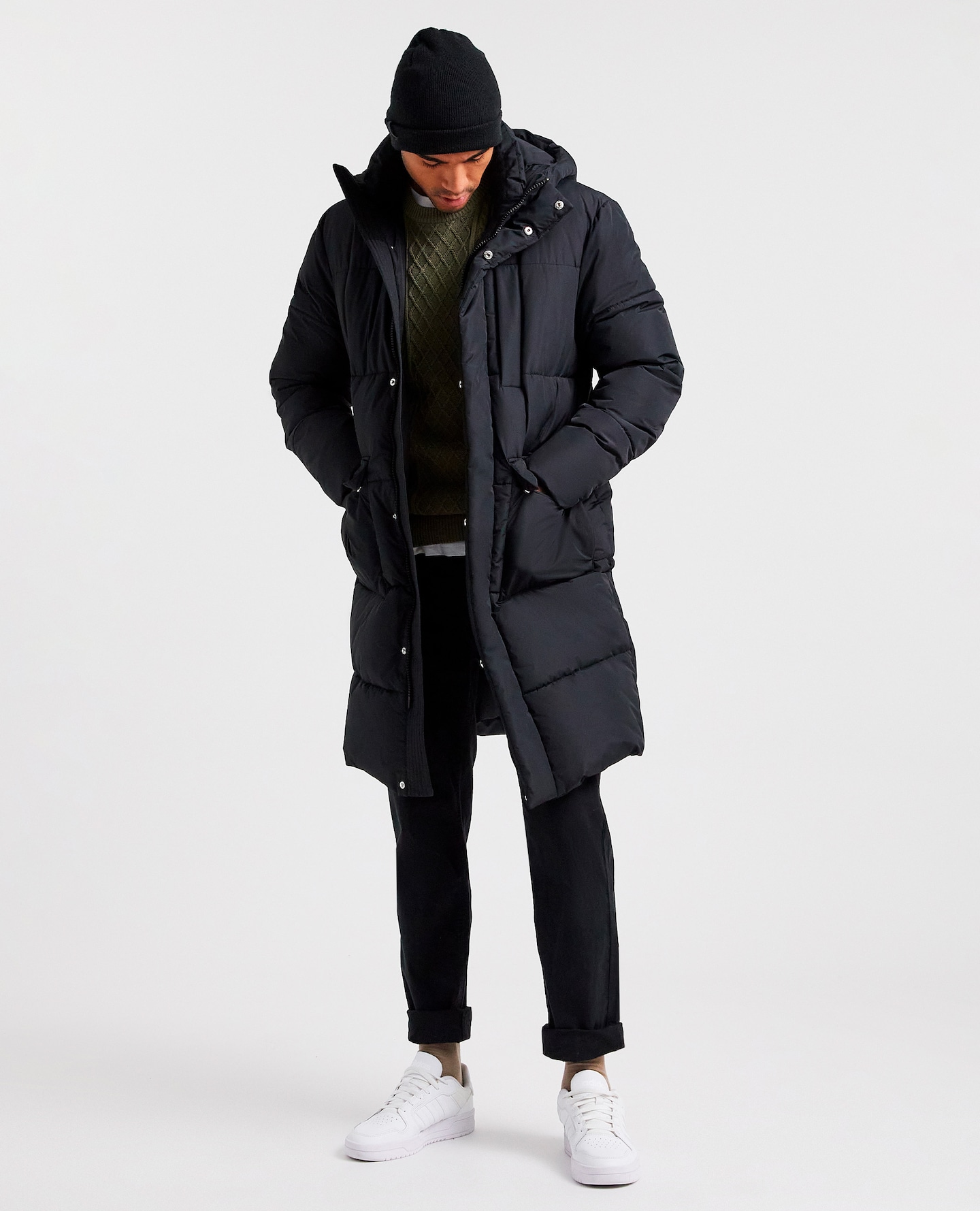 Model wearing black longline puffer jacket