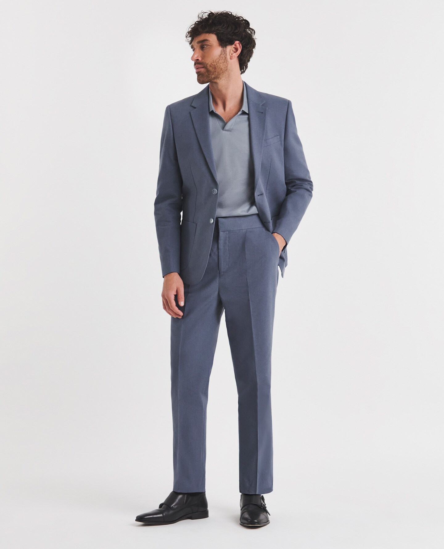 Model in blue suit and blue shirt