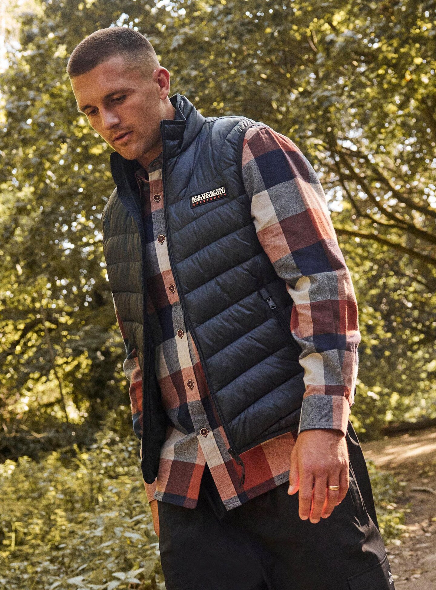 Henry Slade wears Columbia Gilet with checked shirt