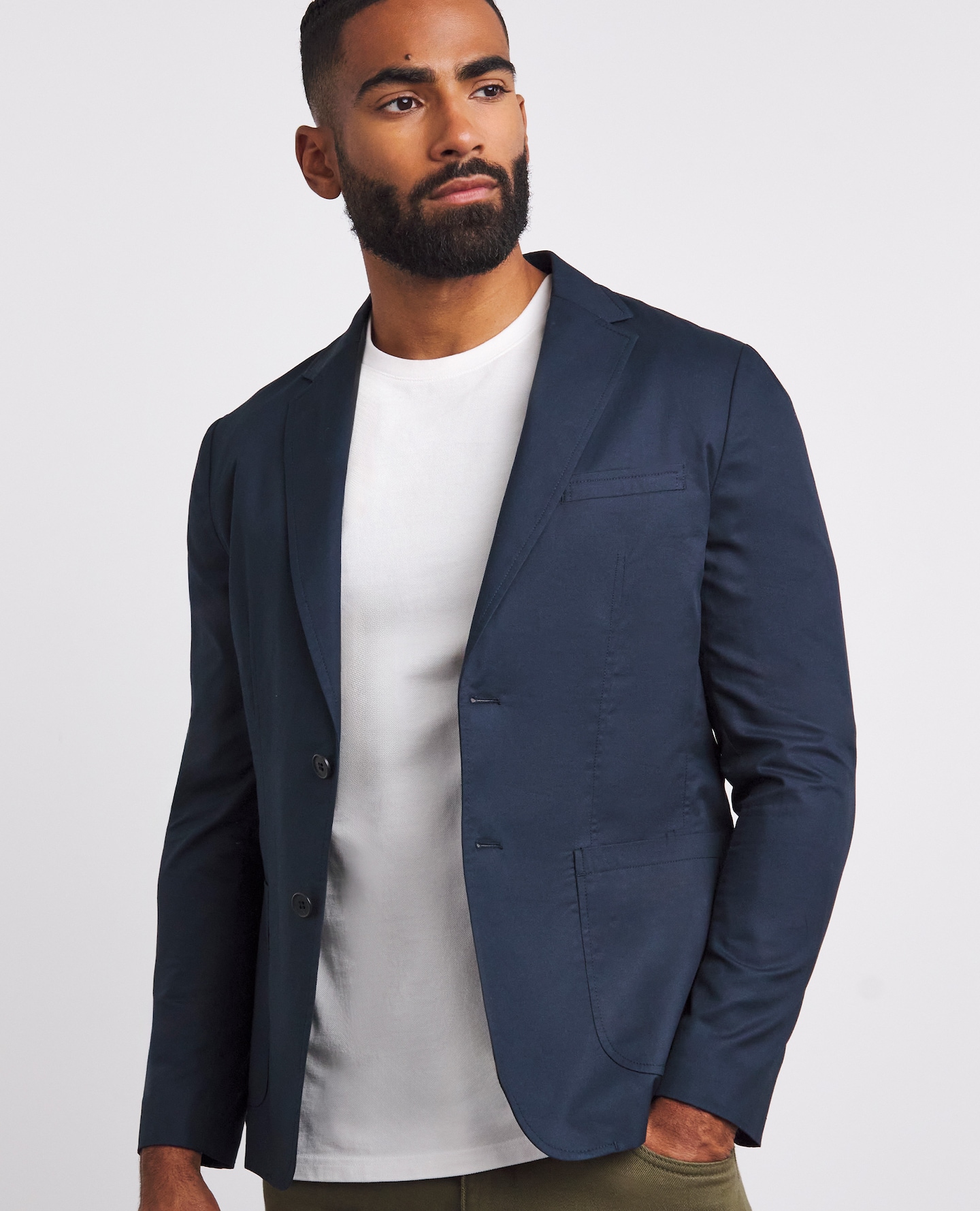 Model wearing navy blazer with white t-shirt