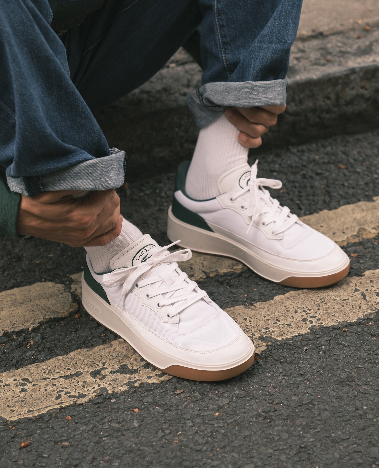 Model wears Lacoste Carnaby Cup Trainers - White/Green