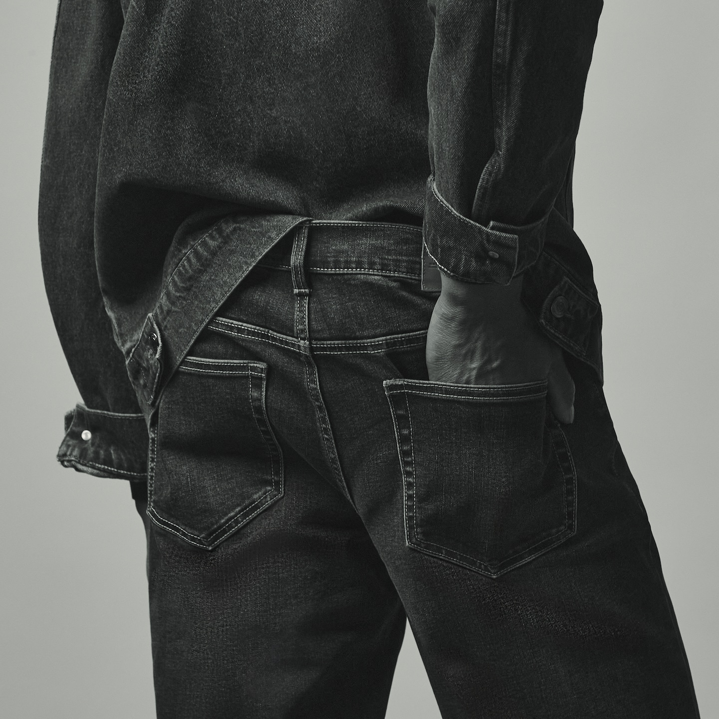 Model wears Union Straight Fit Stretch Jeans Darkwash with denim jacket