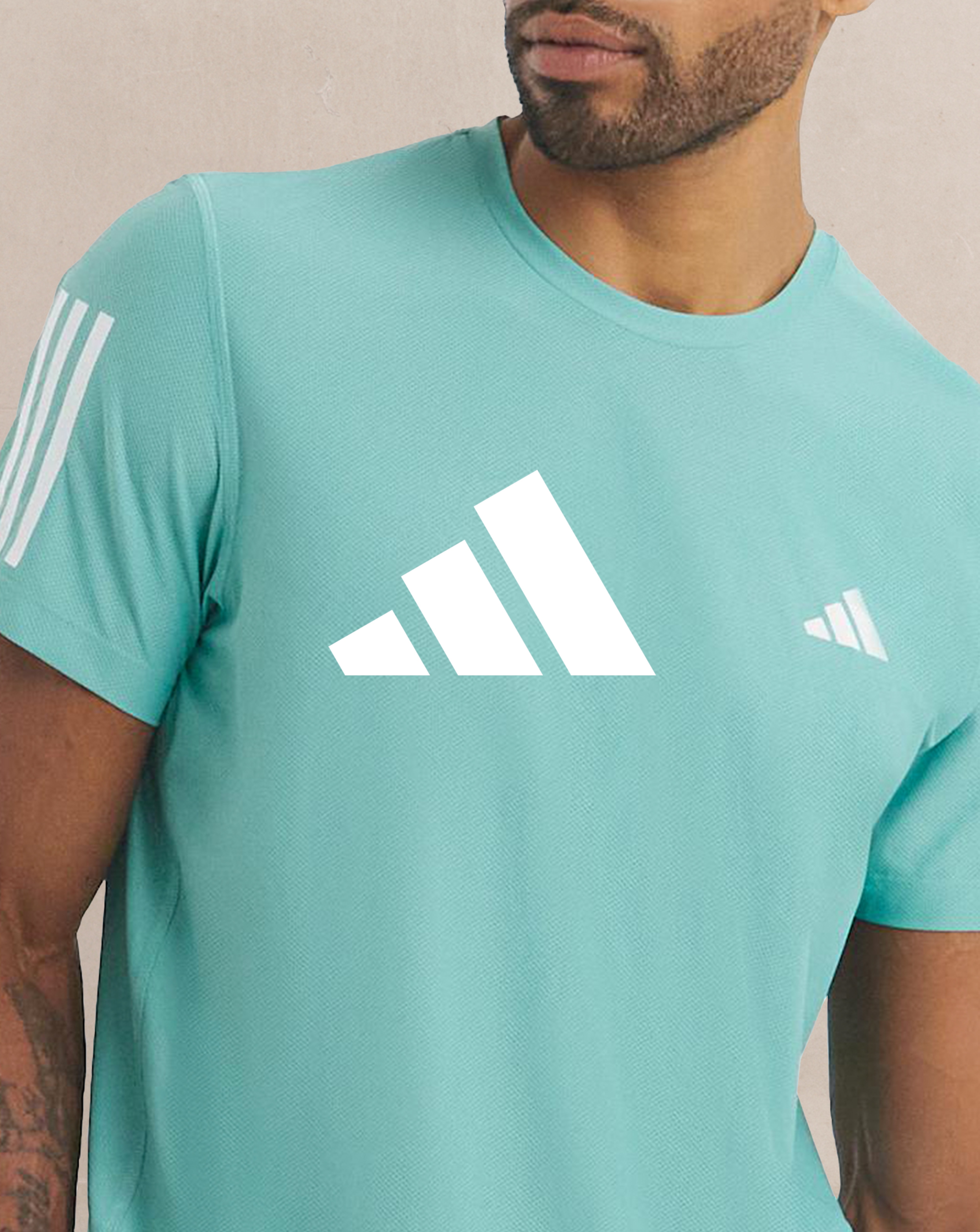 adidas. Model wears adidas Own The Run T-Shirt