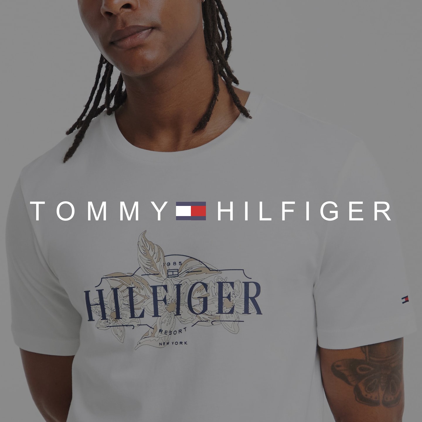 Tommy Hilfiger. Model wears Tommy Hilfiger Short Sleeve Tropical Floral T-Shirt - White
