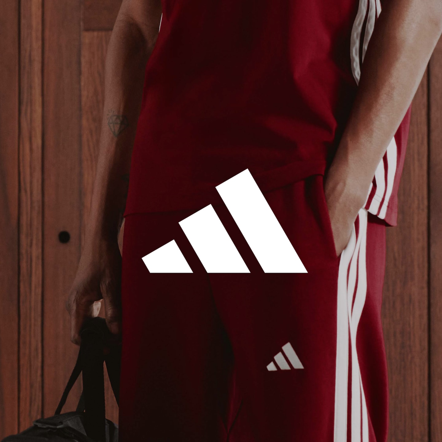 adidas. adidas 3 Stripes Fleece Joggers and Training T-shirt are pictured.