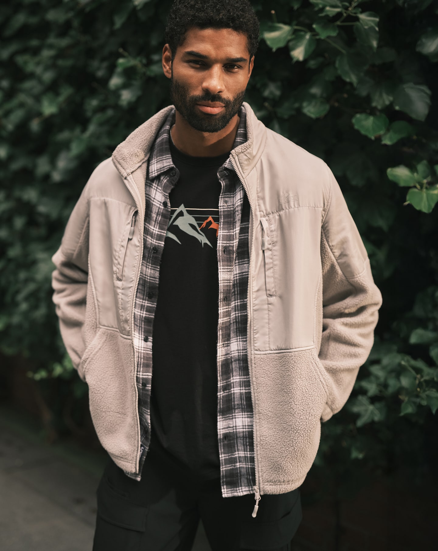 Model wears Snowdonia Snowdonia Nylon Mix Fleece with Snowdonia Mountains Graphic T-Shirt