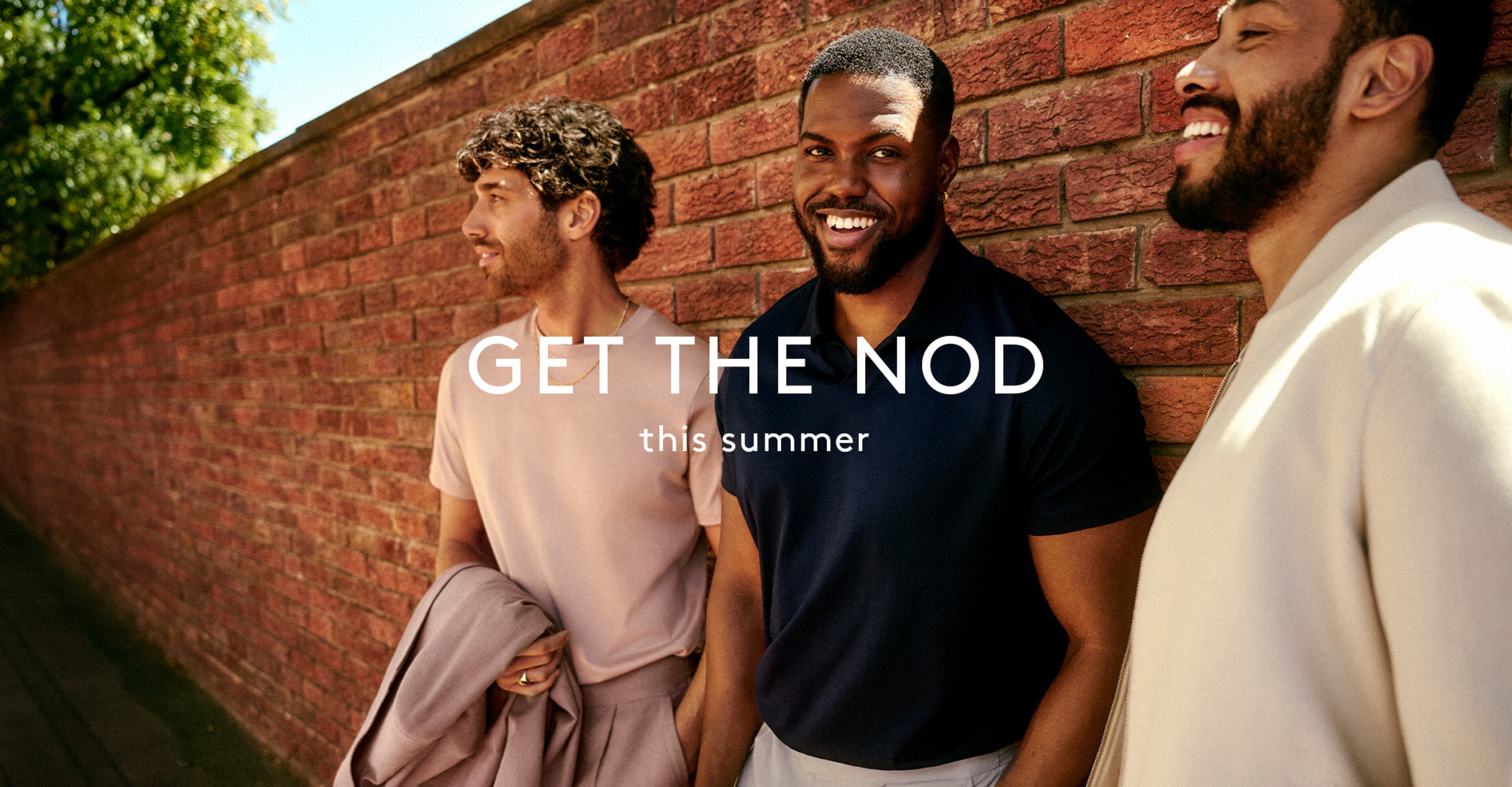 Close up of models standing next to a brick wall with 'Get the nod' campaign overlay
