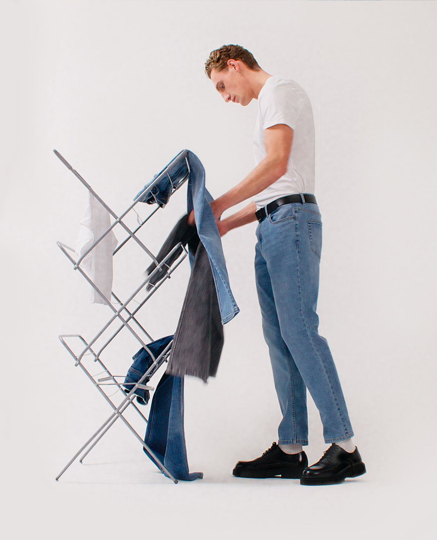 Model hangs washed Jeans on 'air' dryer