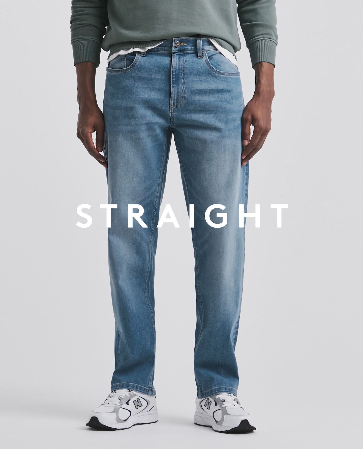Model wearing straight blue jeans