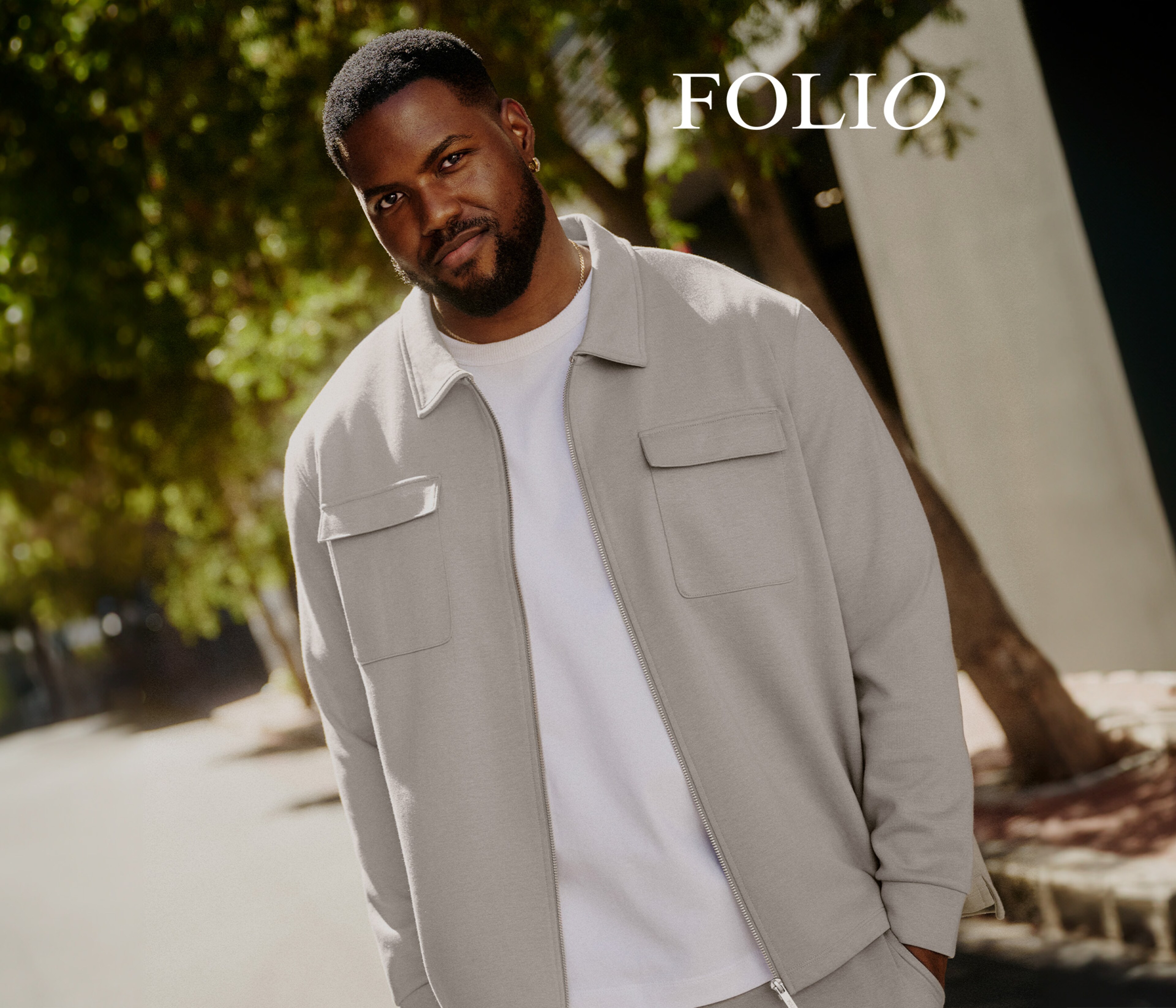 Model wearing Folio cream jacket