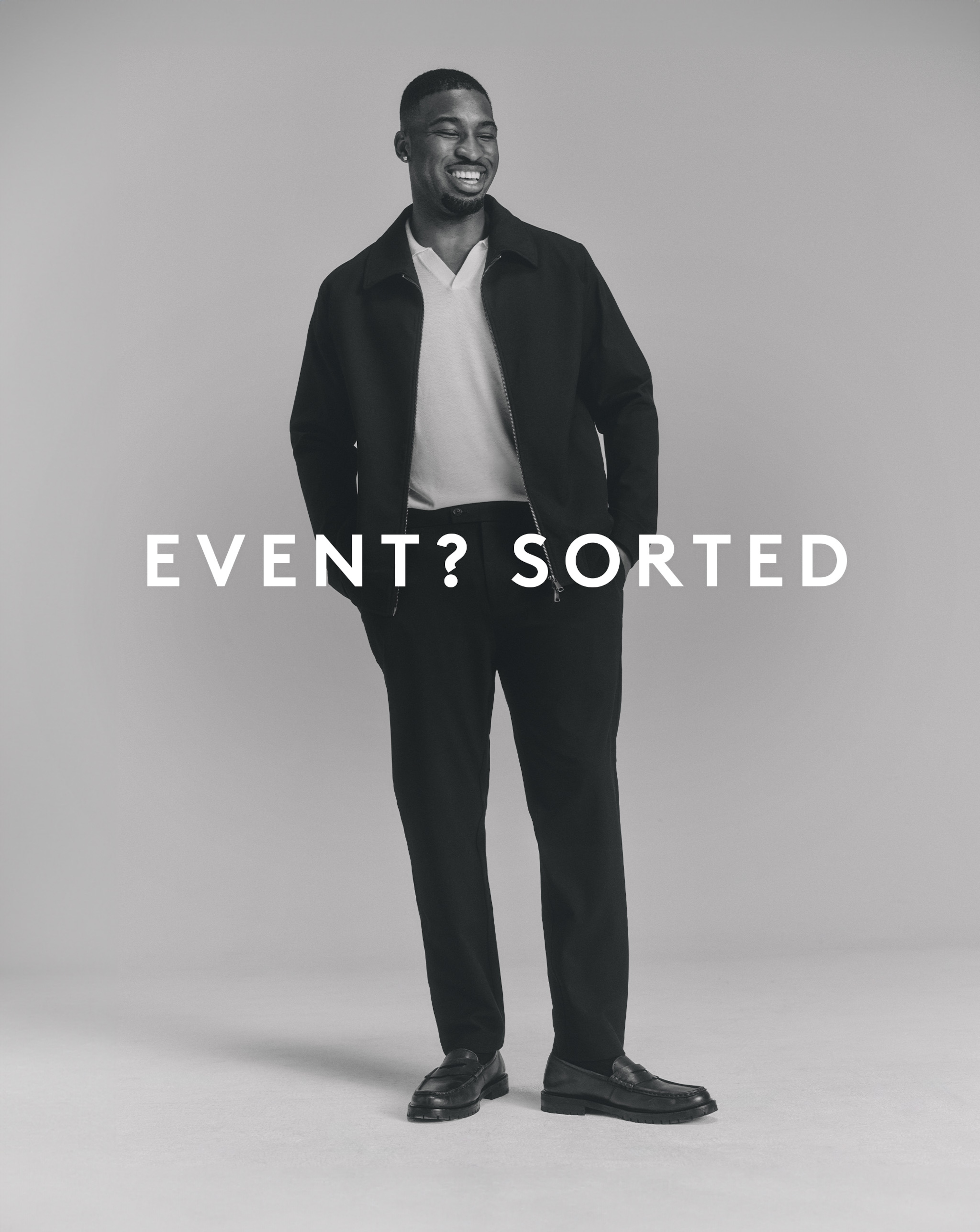 Model wearing a matching smart co-ord with a white shirt