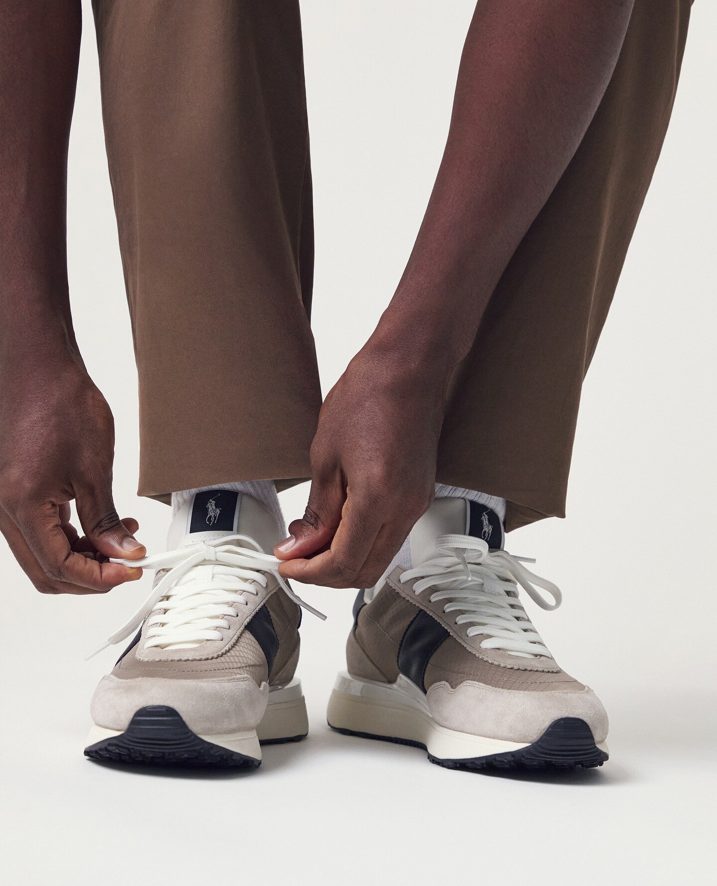 Polo Ralph Lauren Train 89 Trainers - Beige are pictured.