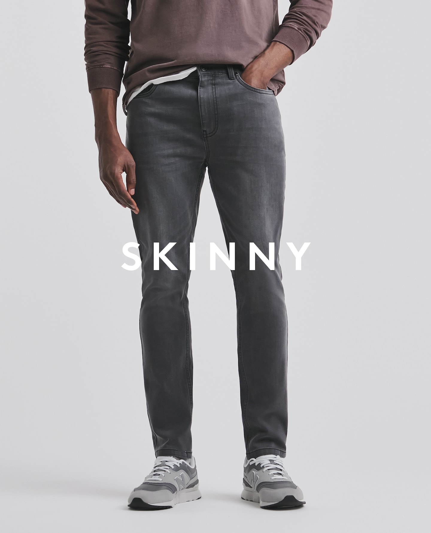 Model wearing skinny black jeans
