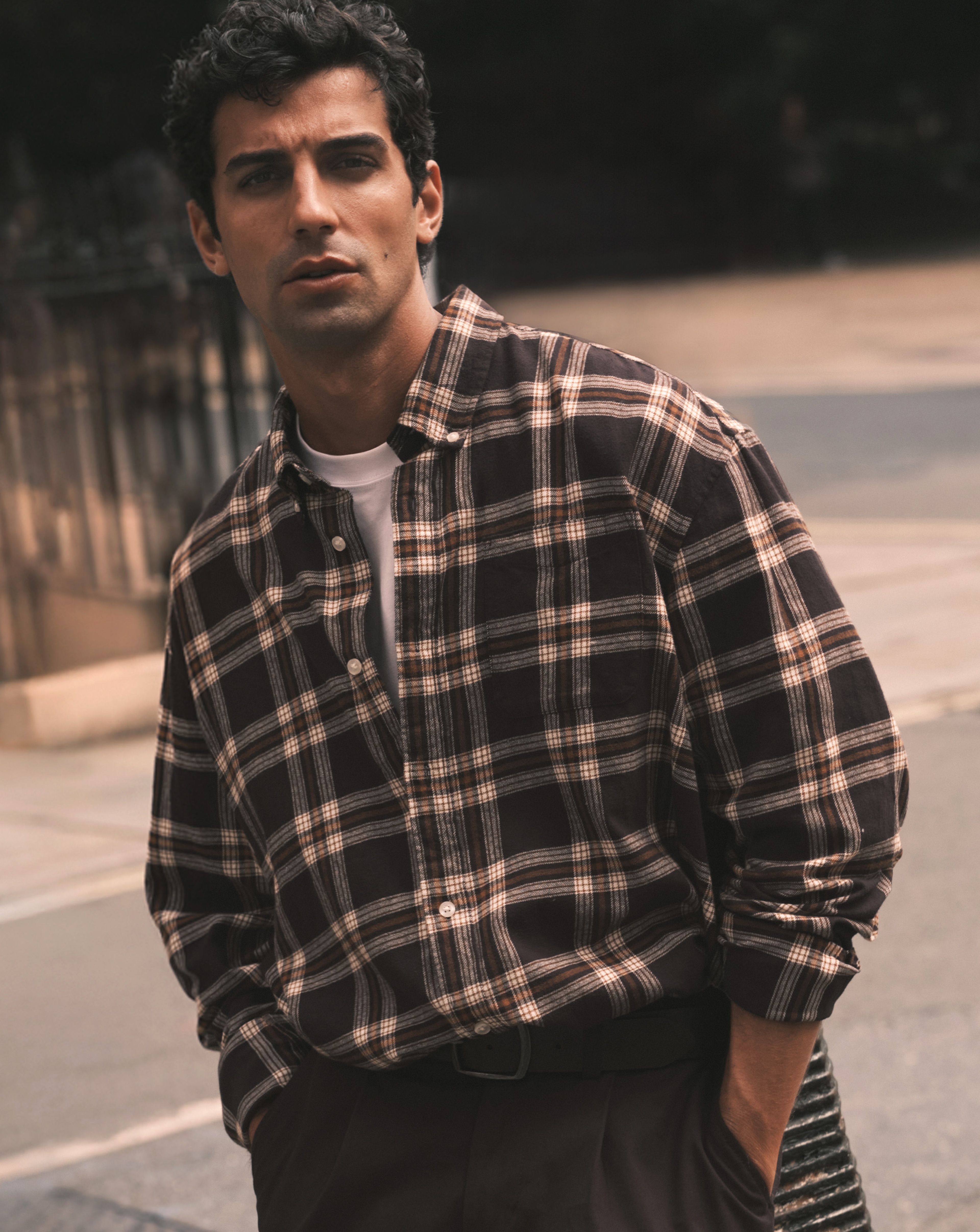 Model wearing chequered shirt