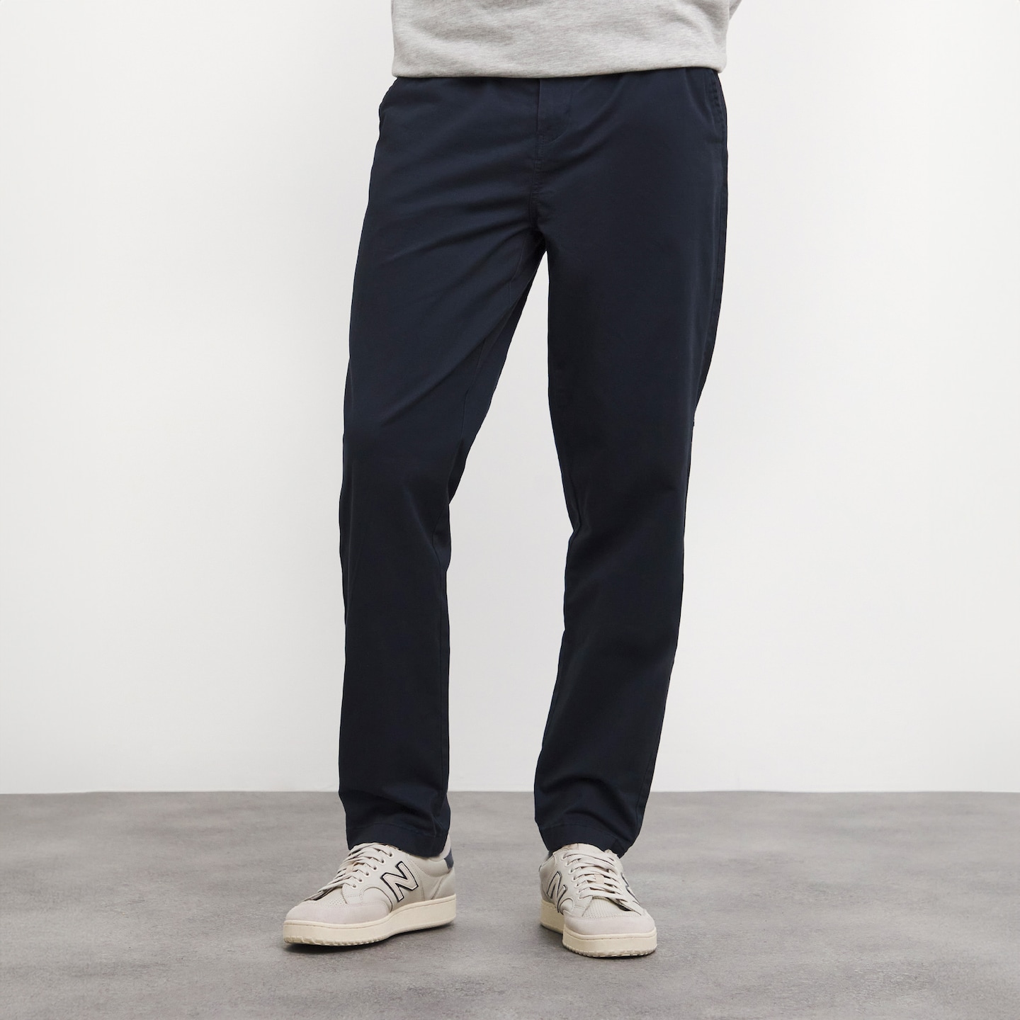 Model wearing black trousers