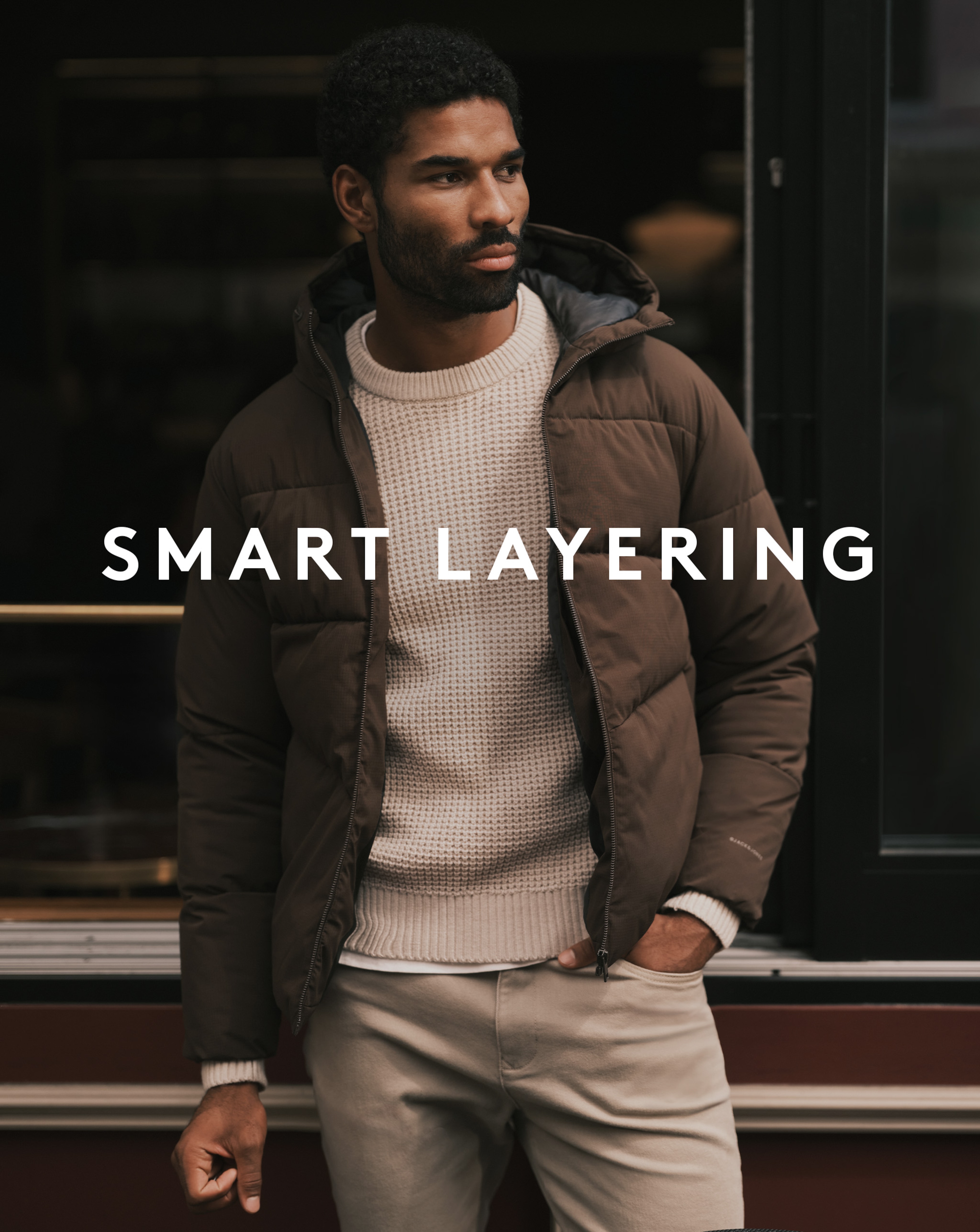 Model wearing khaki Jack & Jones puffer jacket