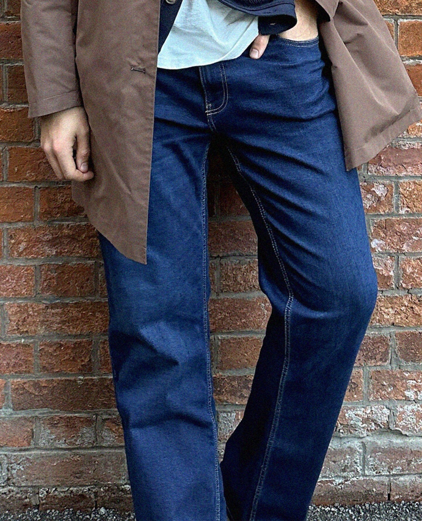 Model wears blue 100% Cotton Straight Fit Jean