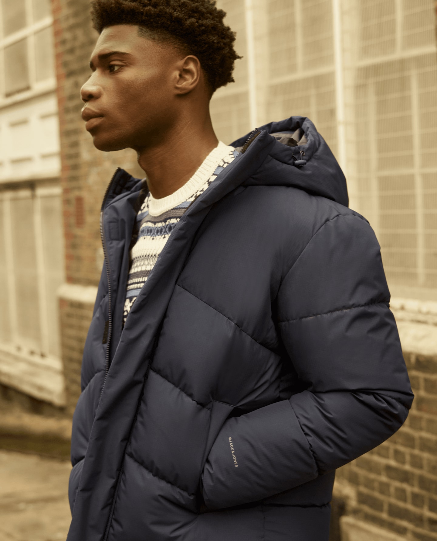 A model wearing a black bubble jacket