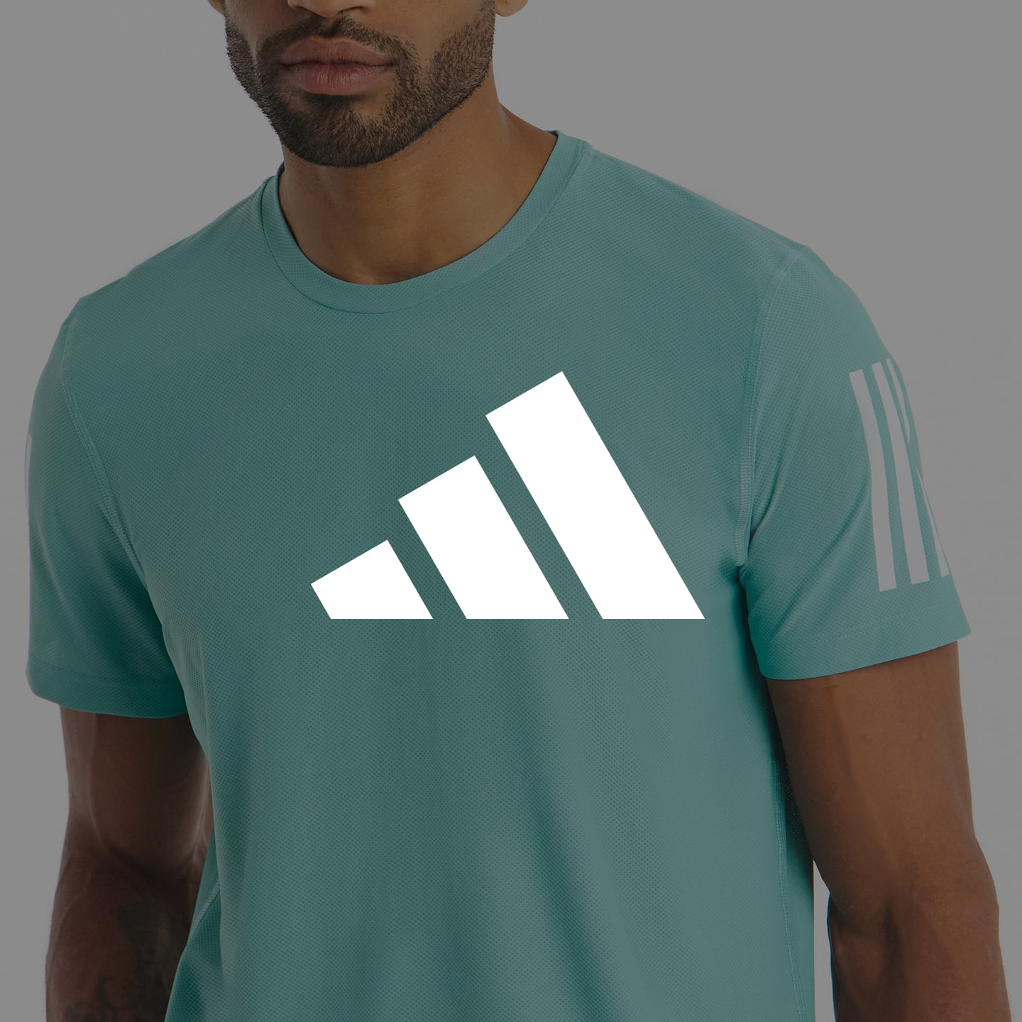 adidas. Model wears adidas Own The Run T-Shirt