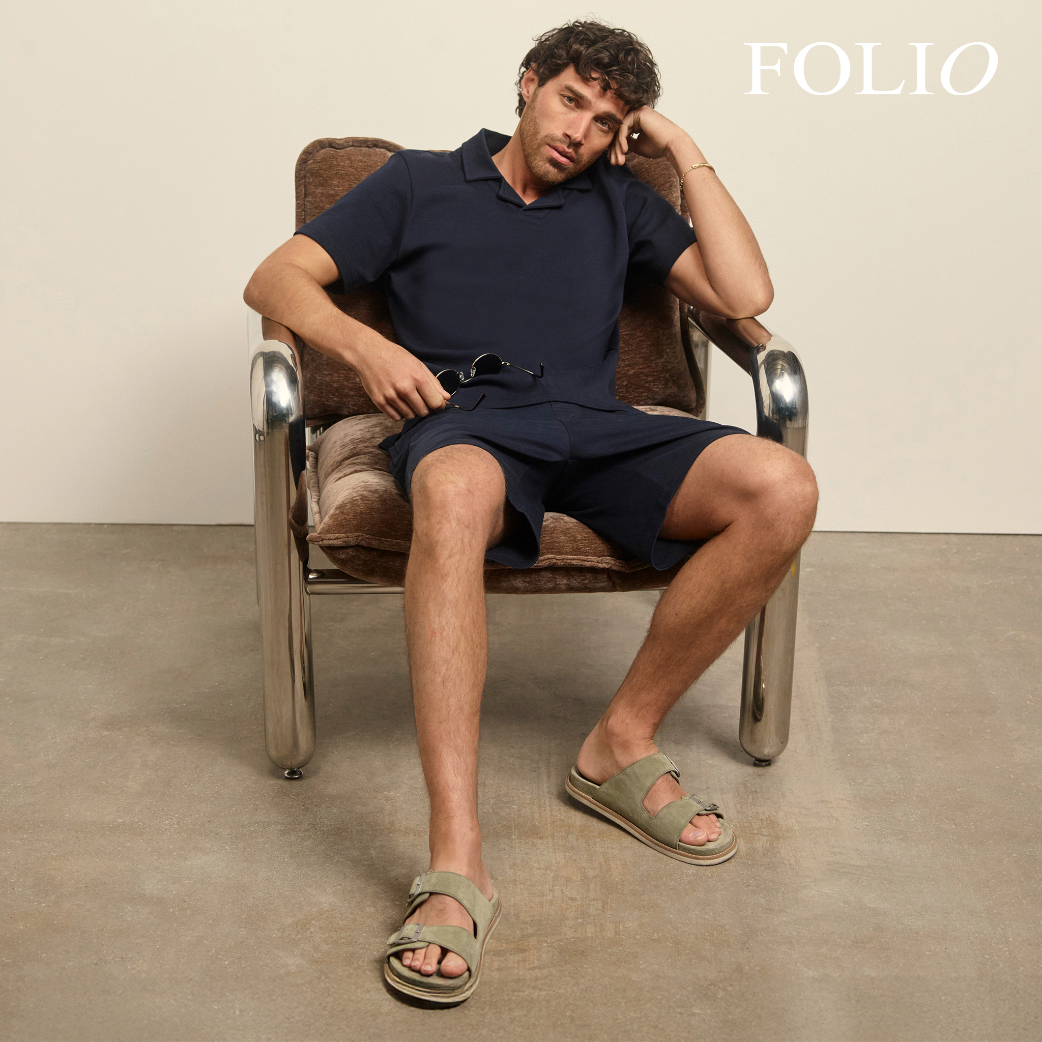 Folio. Model wears Folio Premium 100% Supima Trophy Neck Polo- Navy with Folio Interlock Jersey Sweat Short