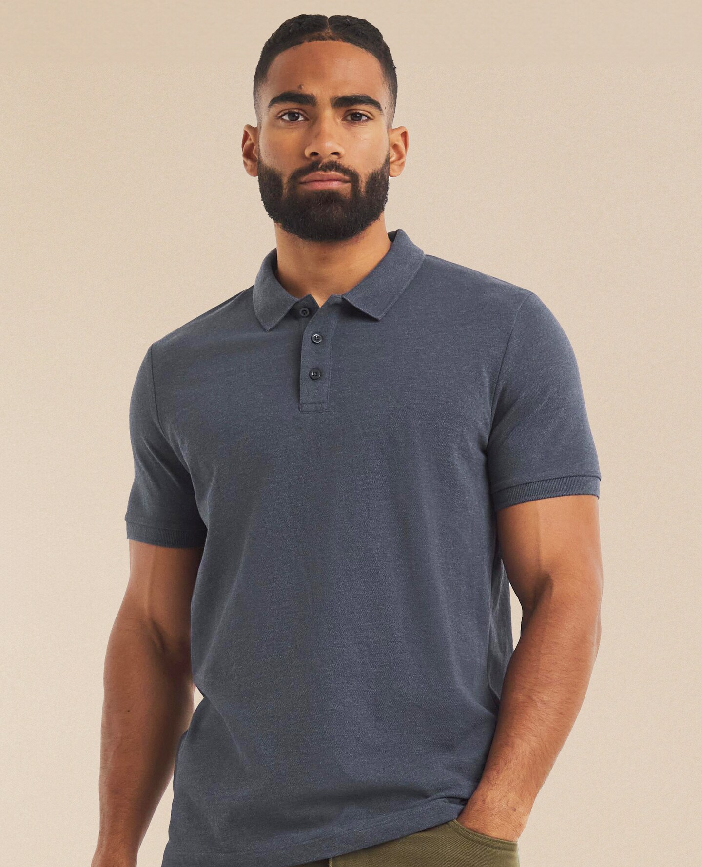 a man wearing a grey polo shirt