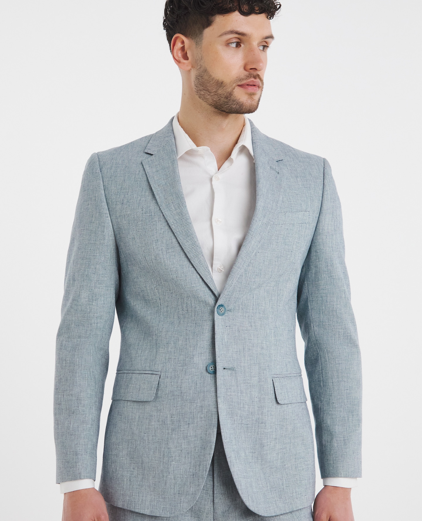 Model wearing light blue, linen blazer