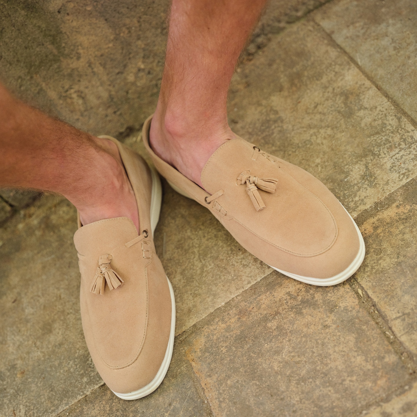 Model wearing beige loafers