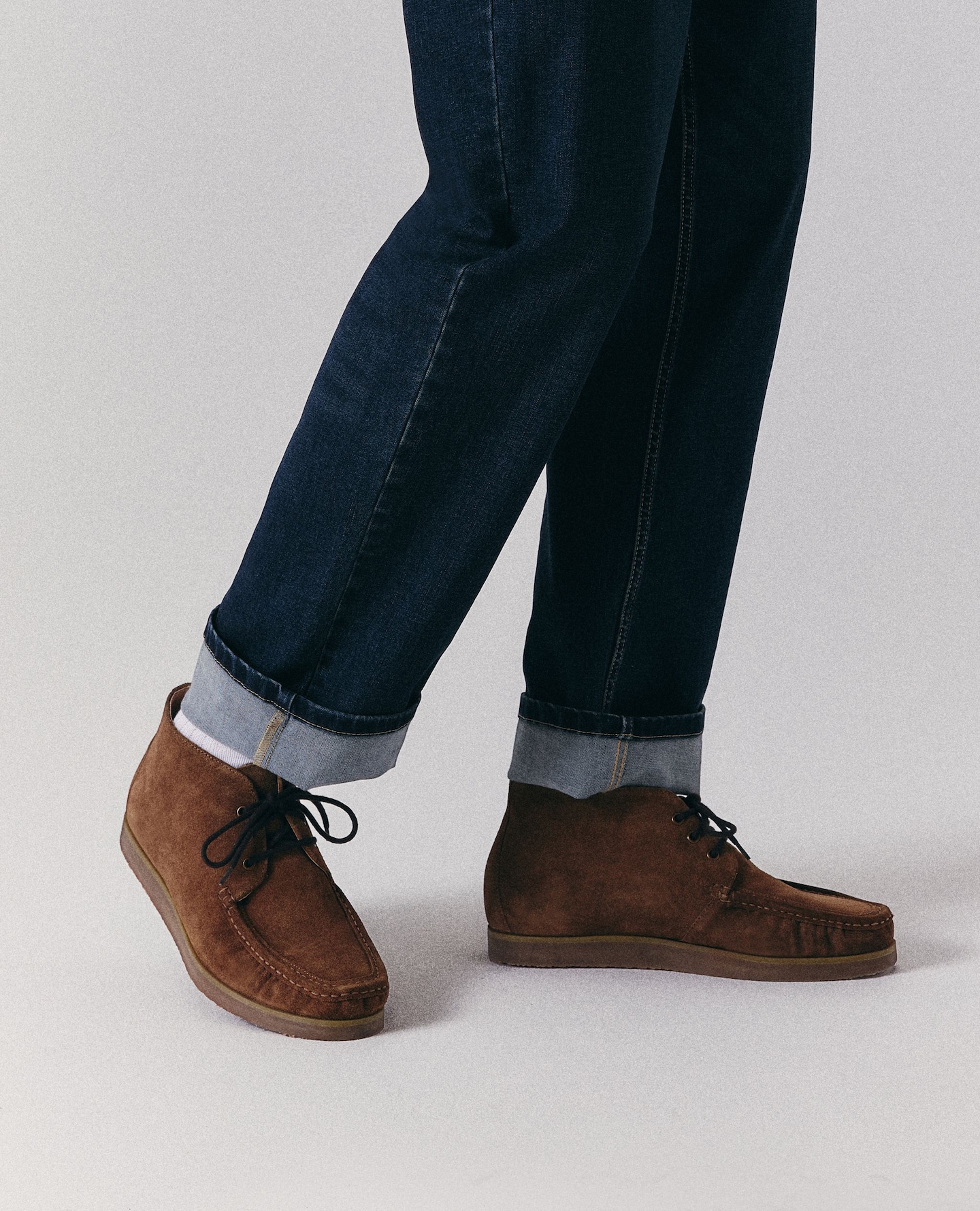 Model wears suede brown lace up shoes