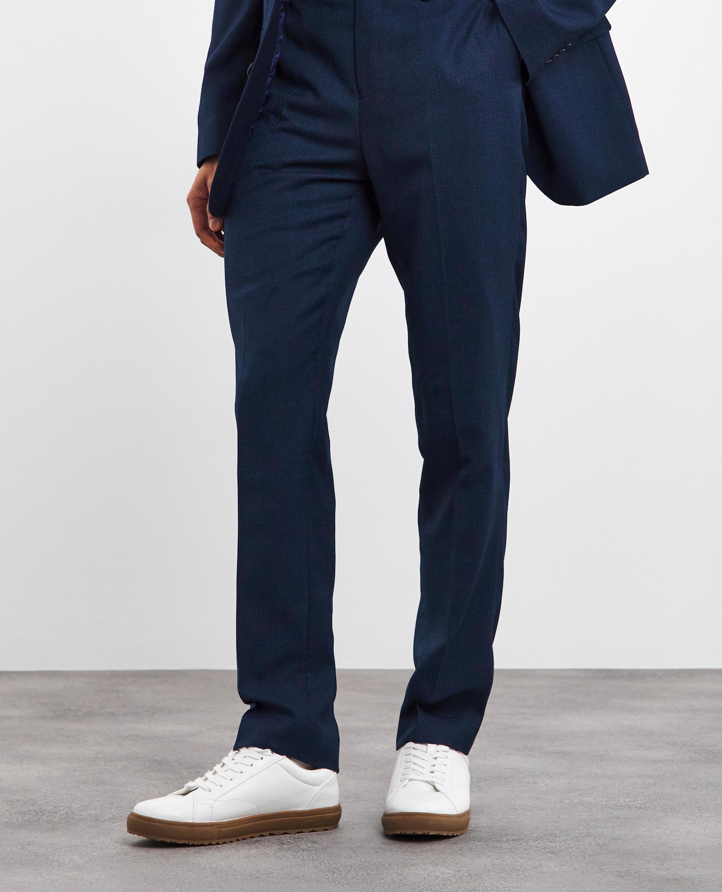 Model wears Navy Regular Fit Stretch Suit Trouser Long