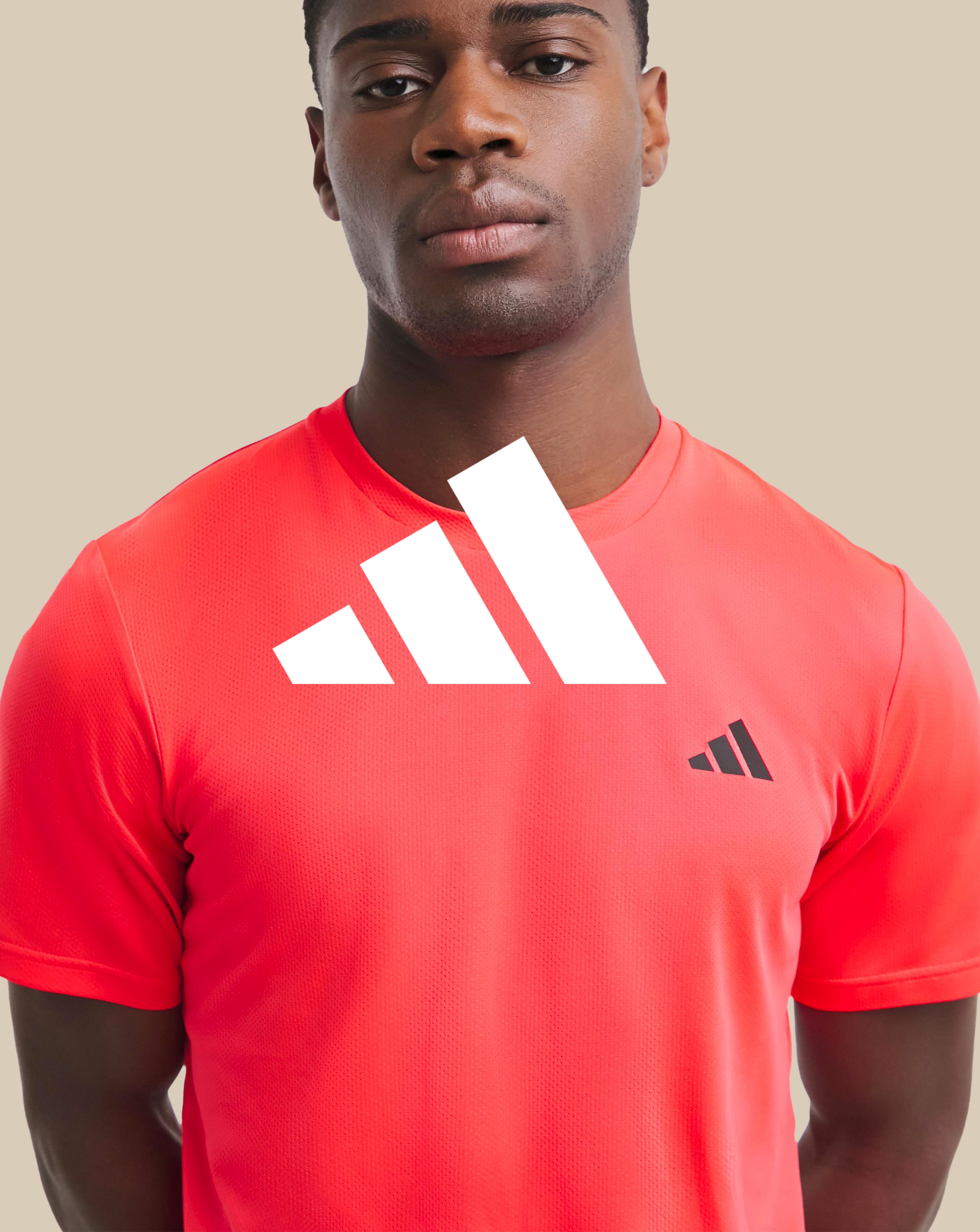 adidas. Model wears adidas Training Essentials Base T-Shirt
