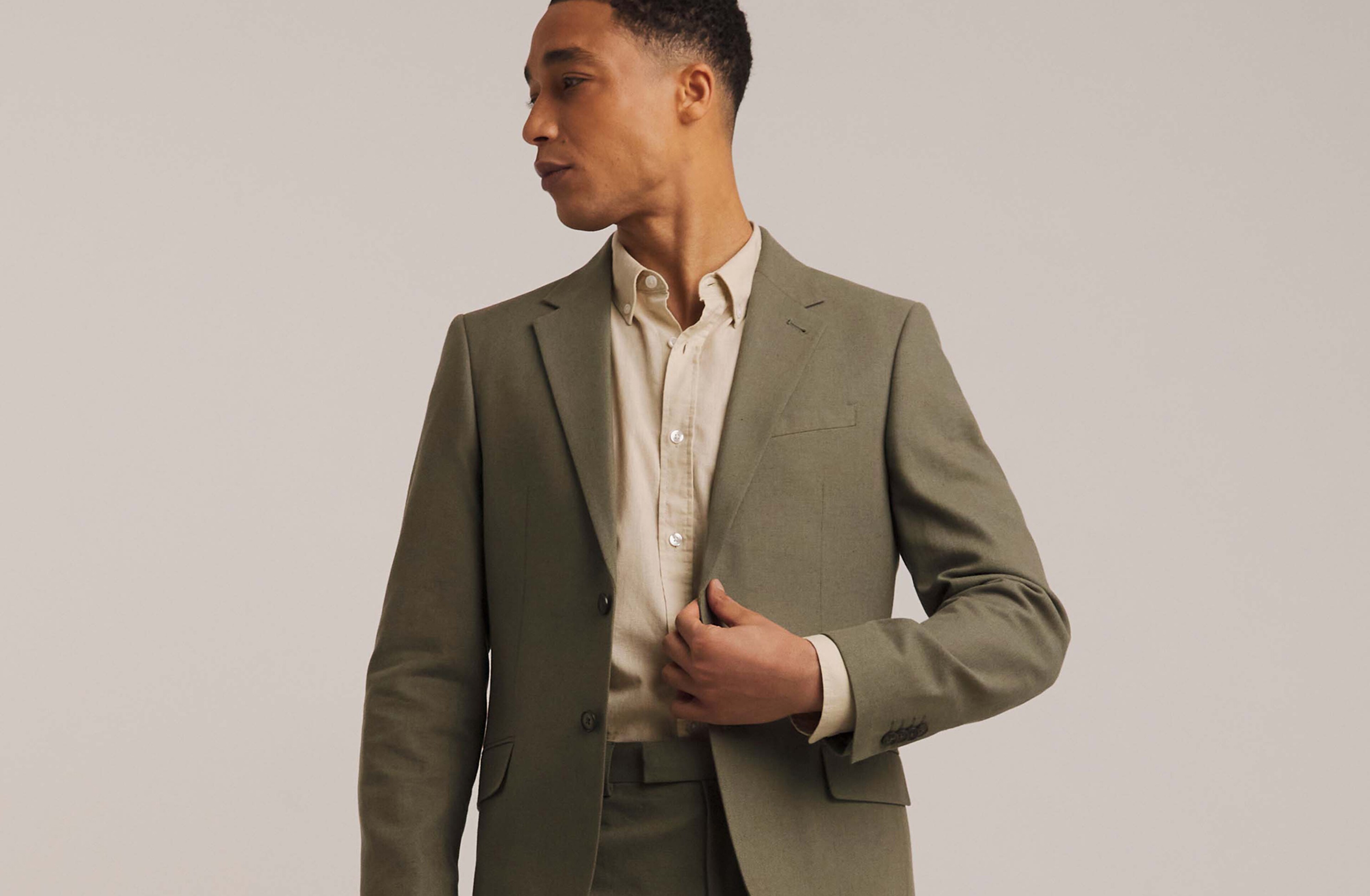 Model wears Linen Blend Blazer in green with beige formal shirt