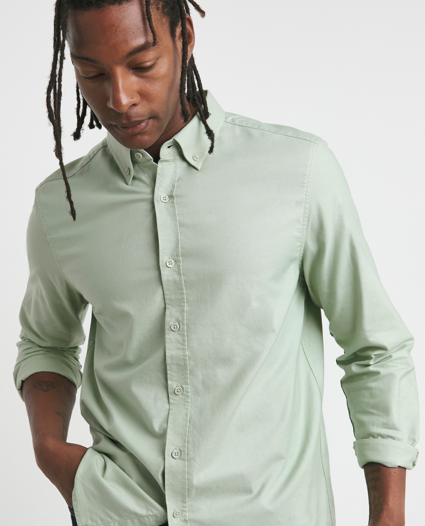 Model wearing green linen shirt