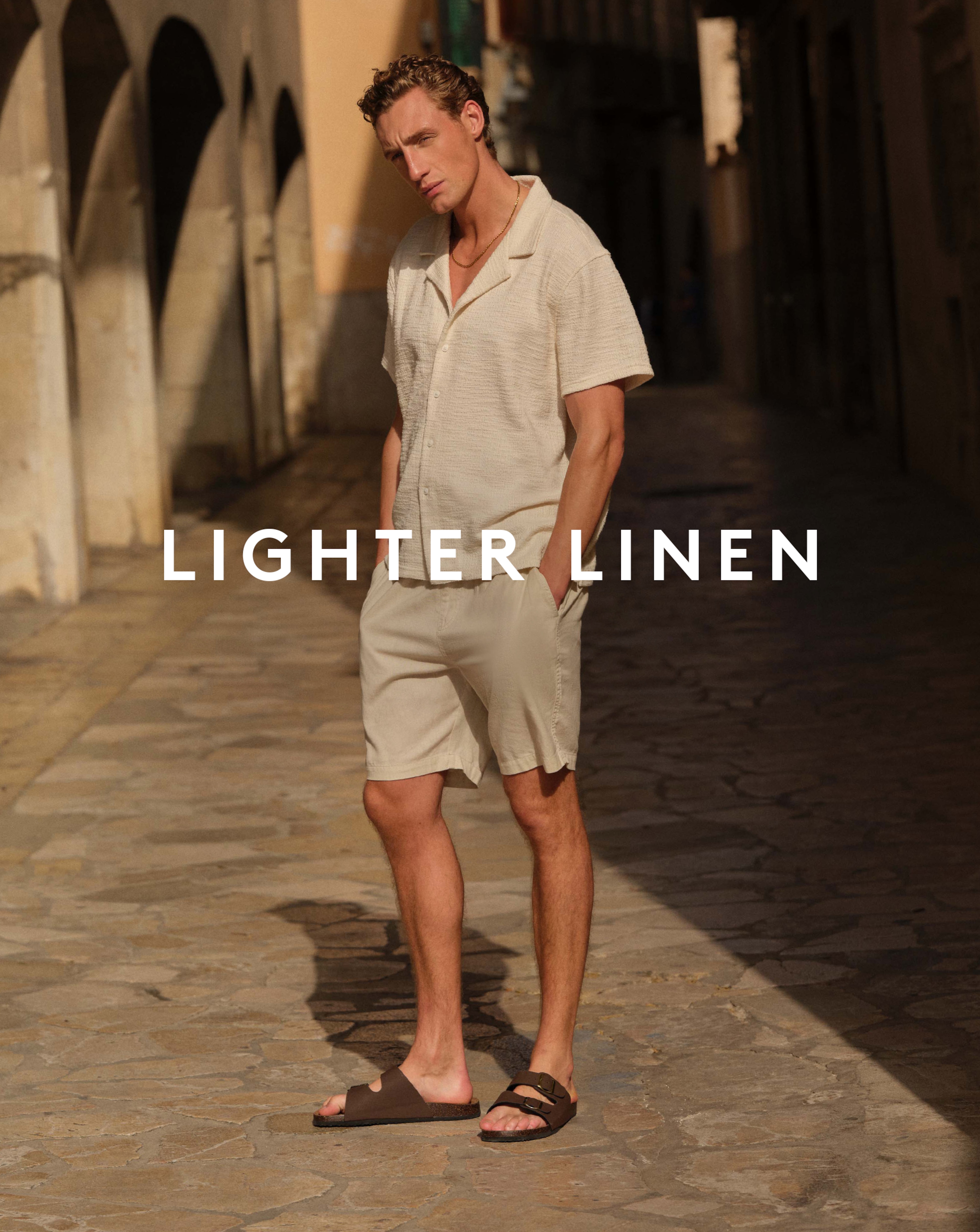 Lighter Linen. Model wears Textured Revere Collar Jersey Shirt and Shorts
