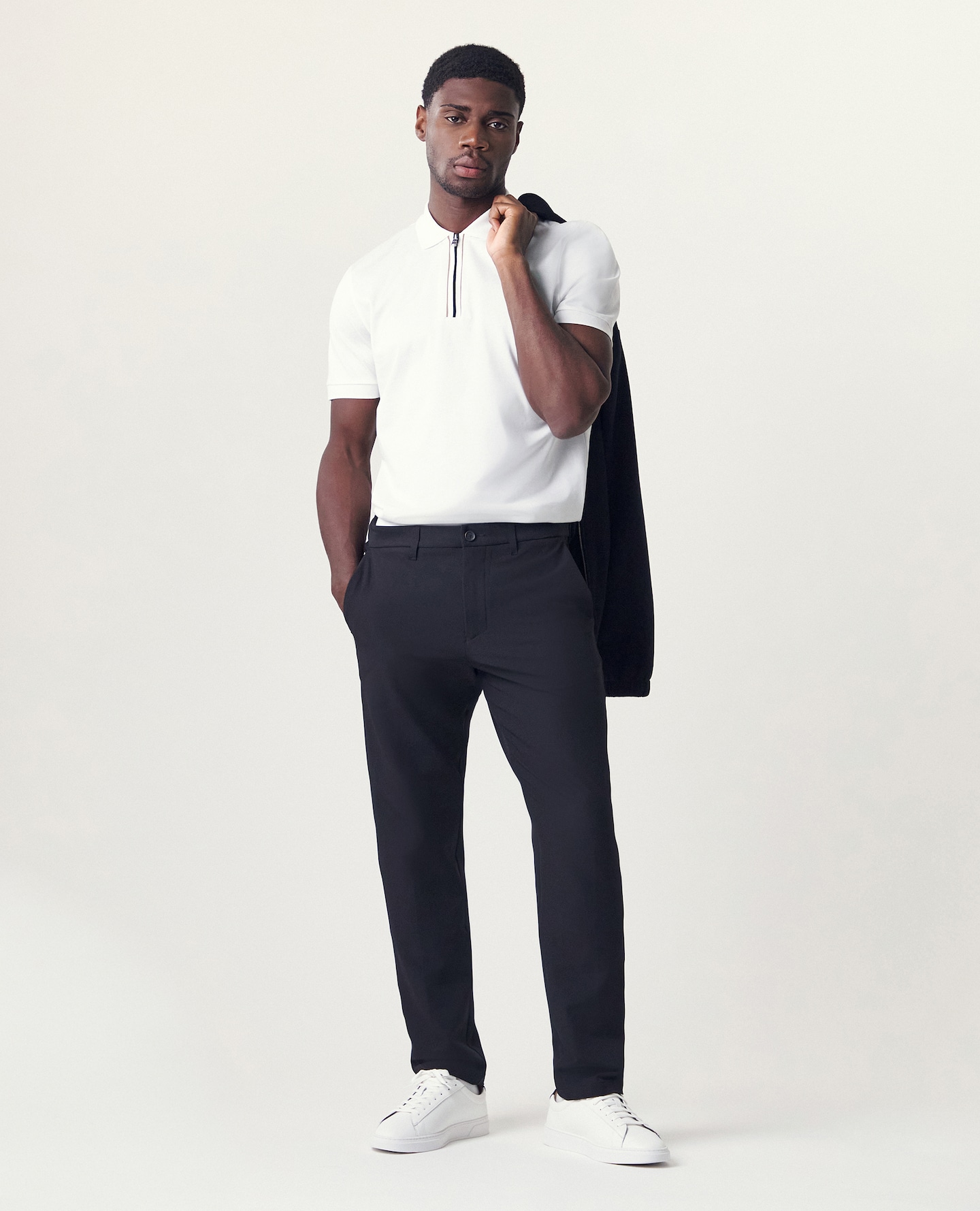 Modle wears BOSS Short Sleeve Zip Neck Polo - White with smart navy chinos