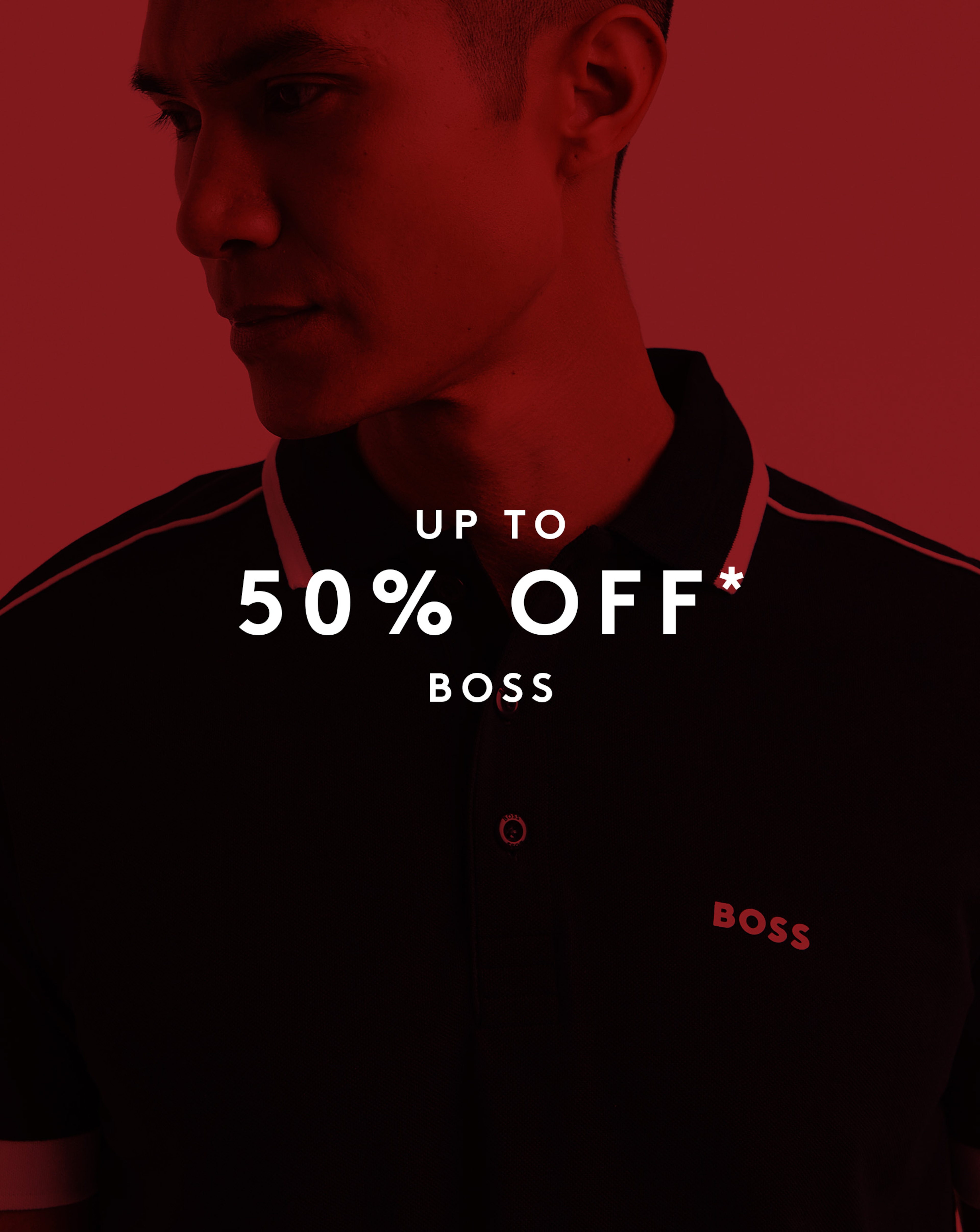 Model wearing BOSS polo with a red sale overlay. Up to 50% off BOSS