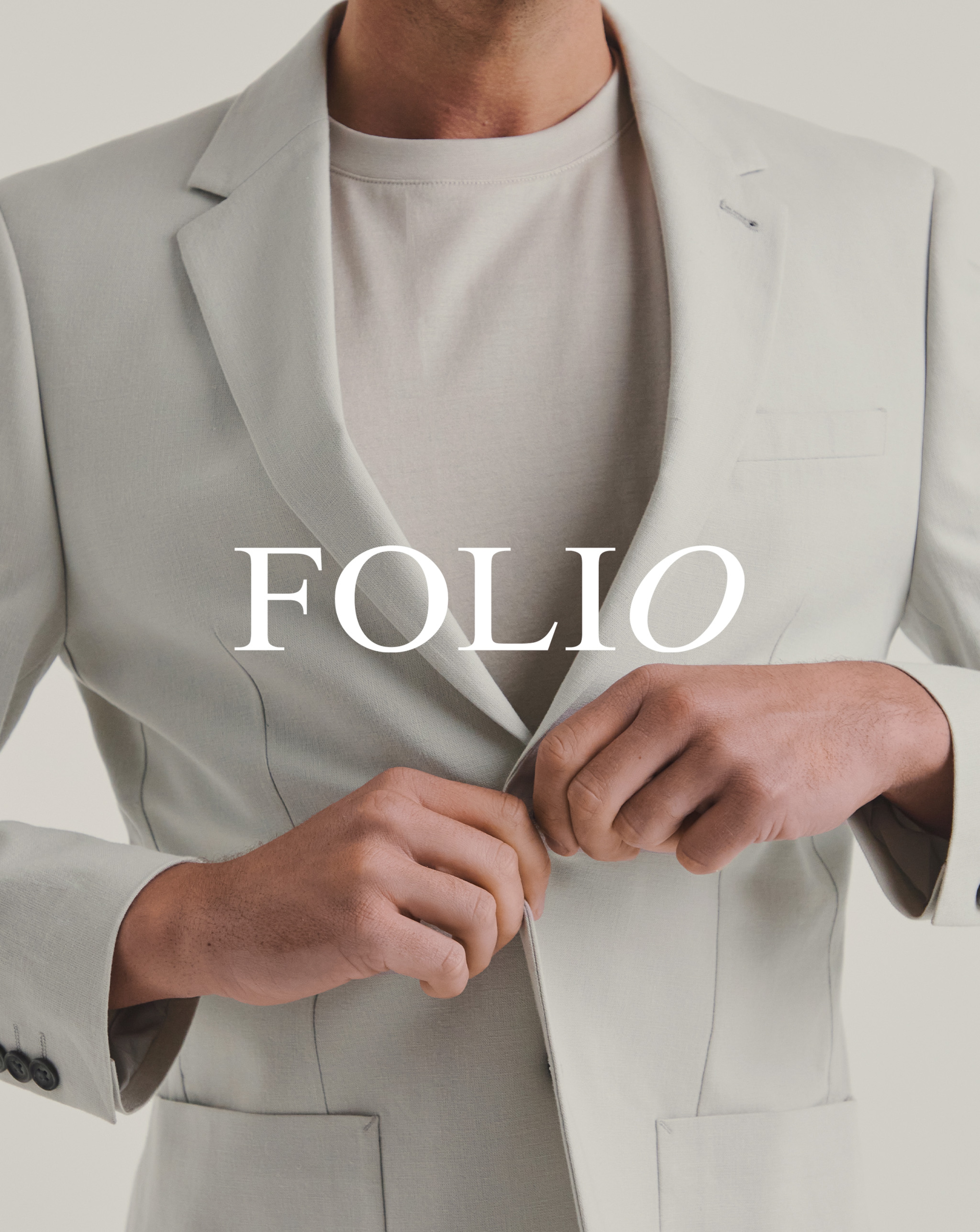 Model wearing white Folio suit