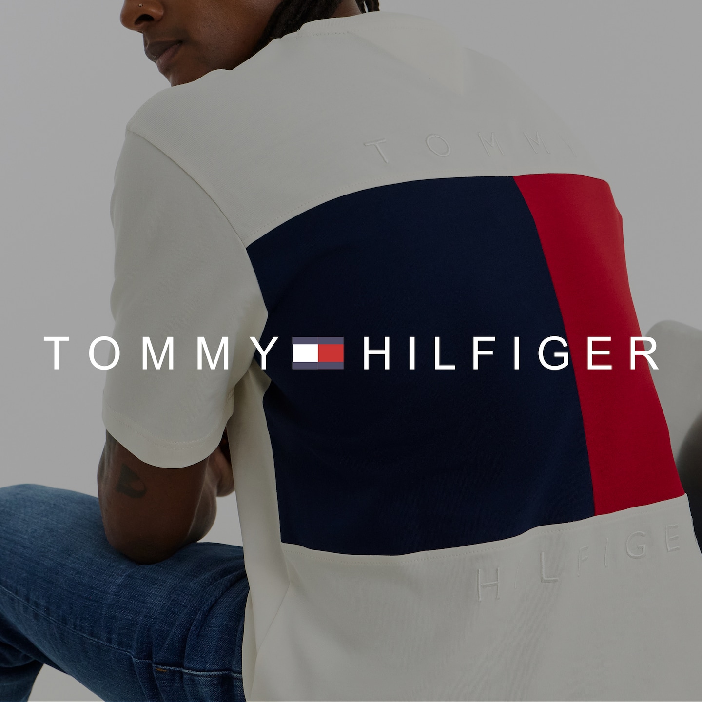 Tommy Hilfiger. Model wears Tommy Hilfiger Short Sleeve Back Flag T-Shirt - White
