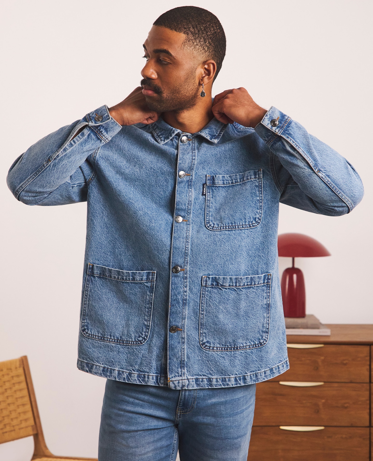 Model wearing denim jacket and jeans