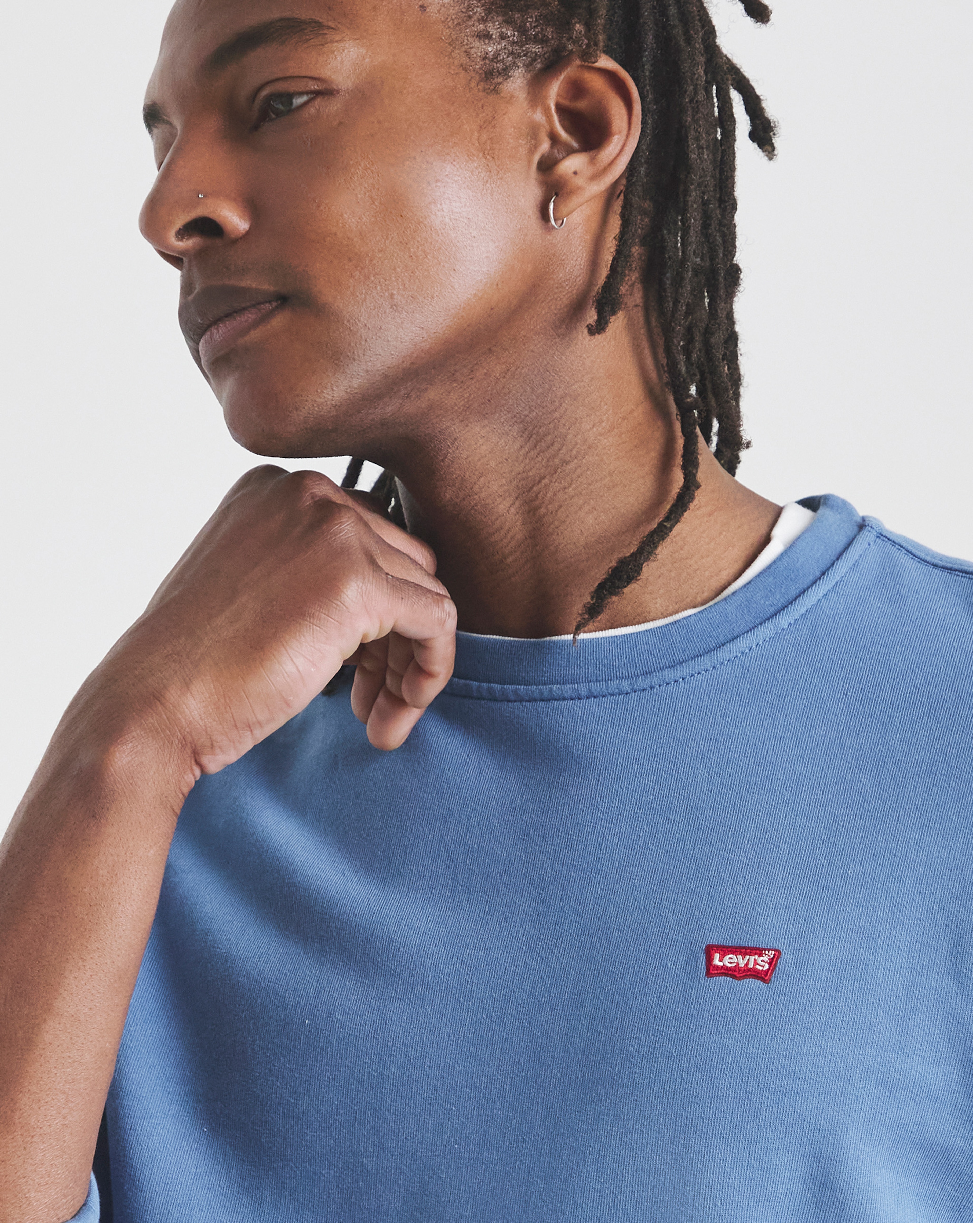 Close up of model wearing blue Levi's t-shirt