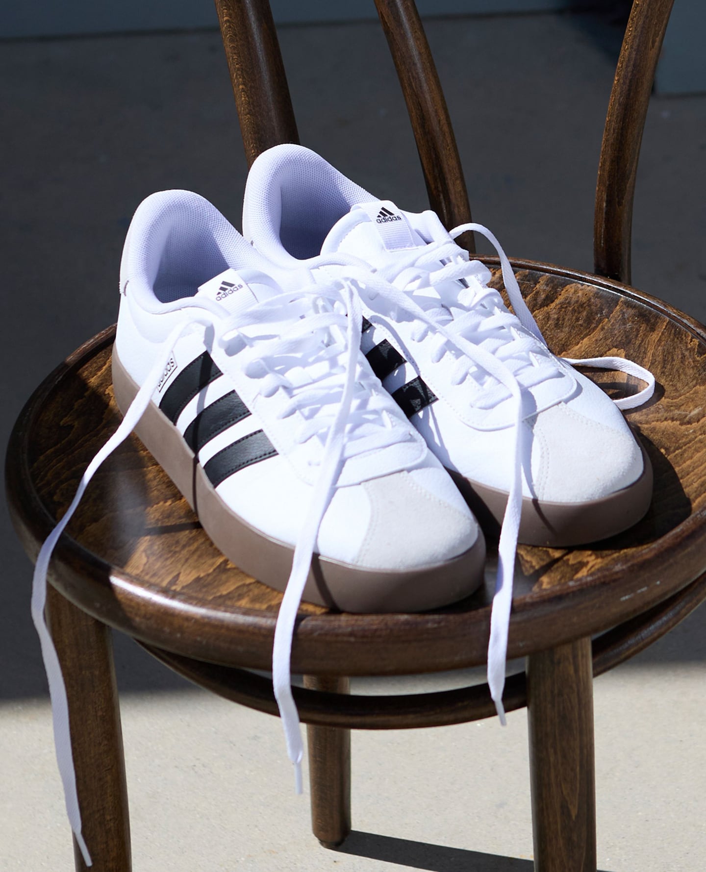 White with black strip adidas trainers
