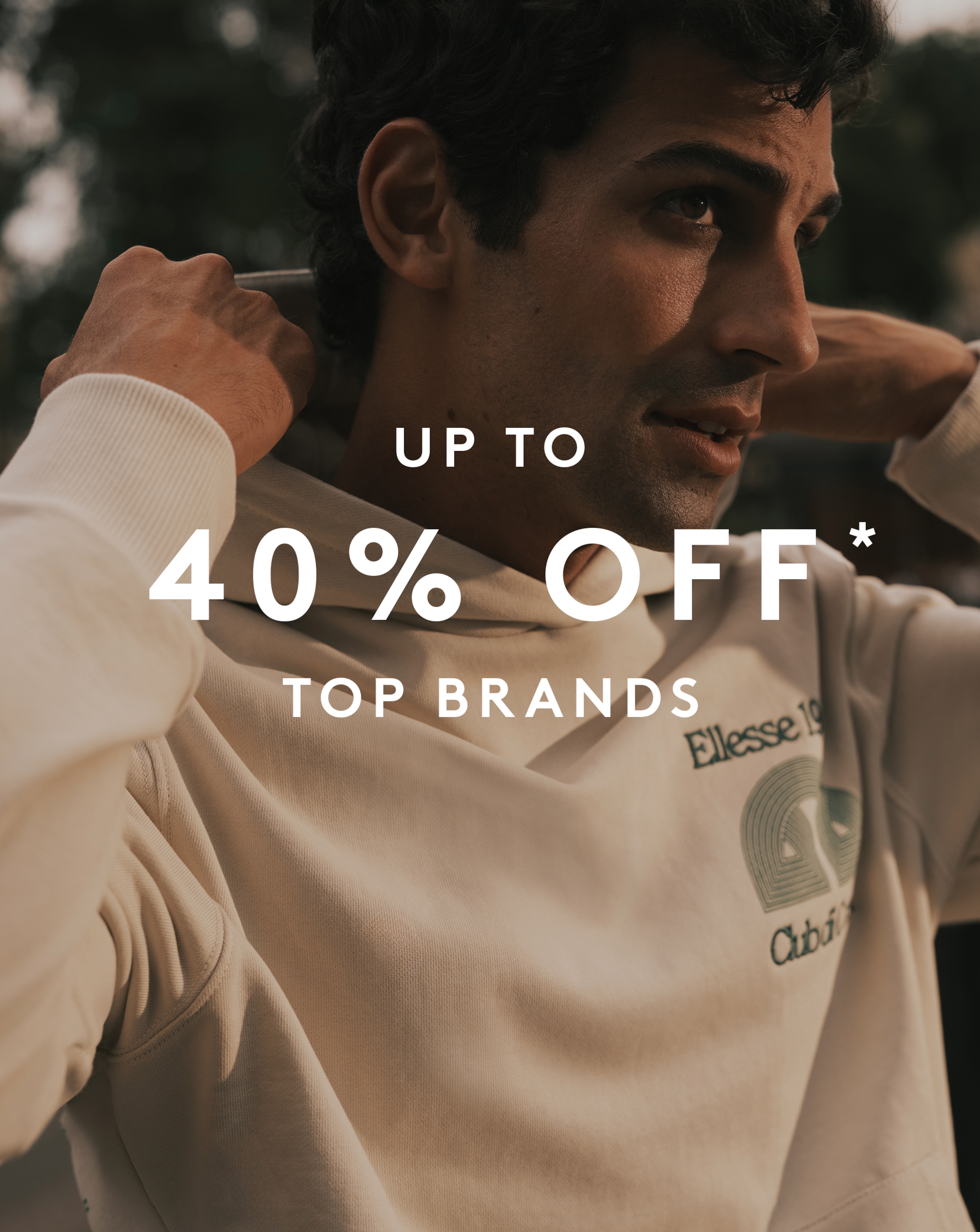 Up to 40% Off* Top Brands. Model wears ellesse Club Di Corsa Hoodie