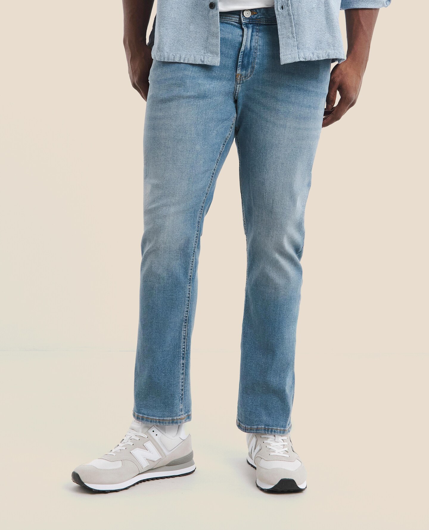 Model wears Jack & Jones Slim Tapered Fit Glenn Jeans In Light Blue