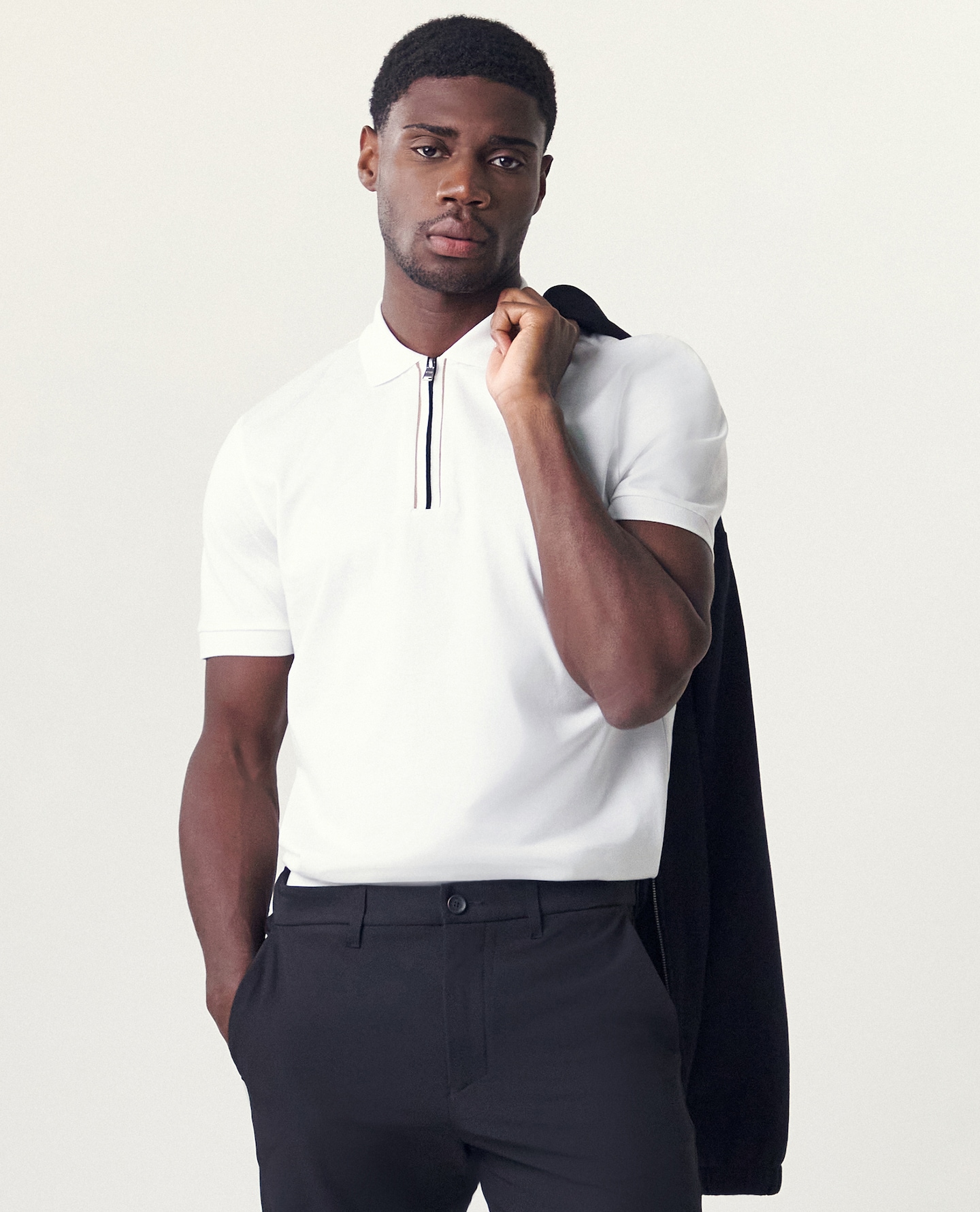 Model wears BOSS Short Sleeve Zip Neck Polo - White
