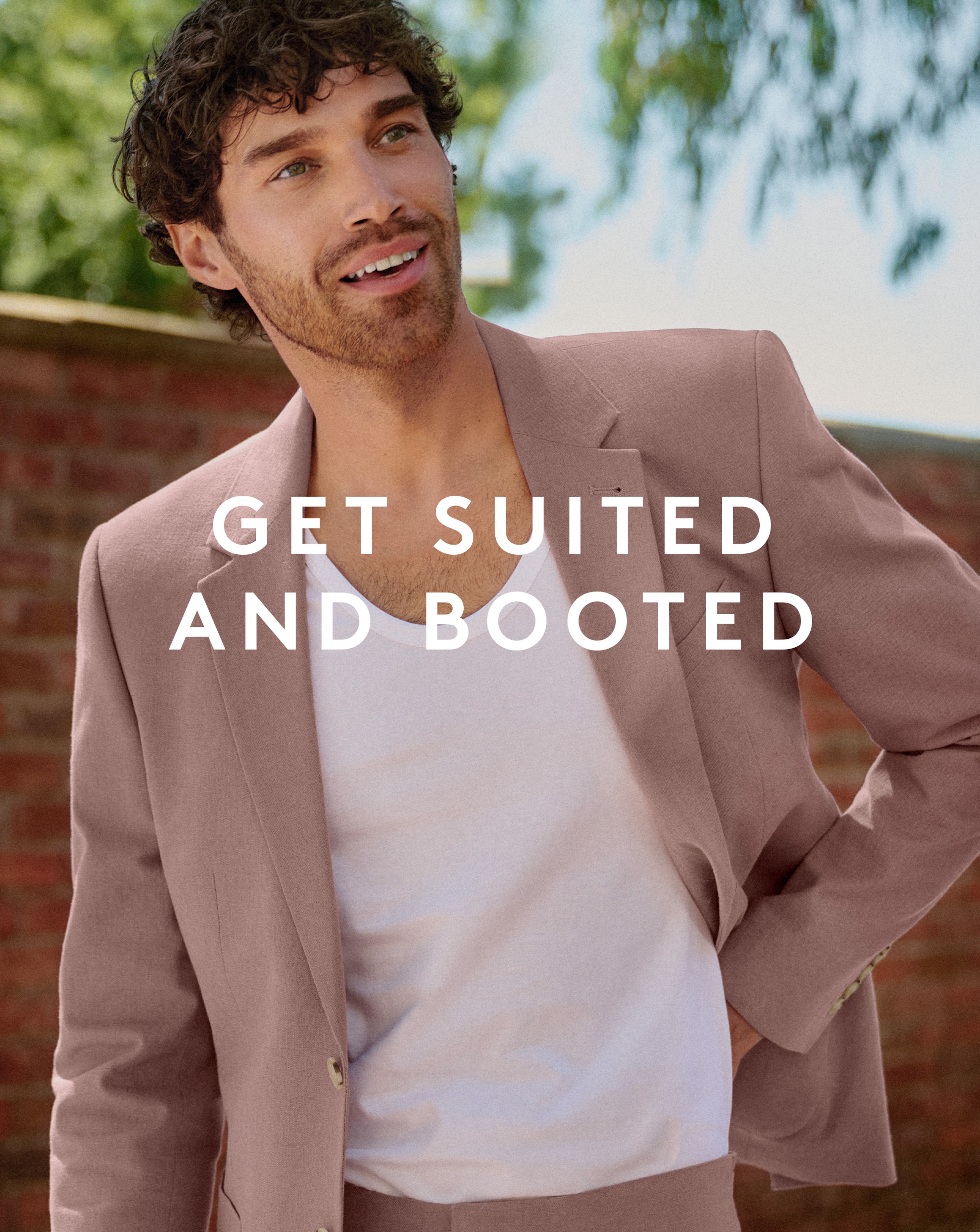 Model wearing pink linen suit