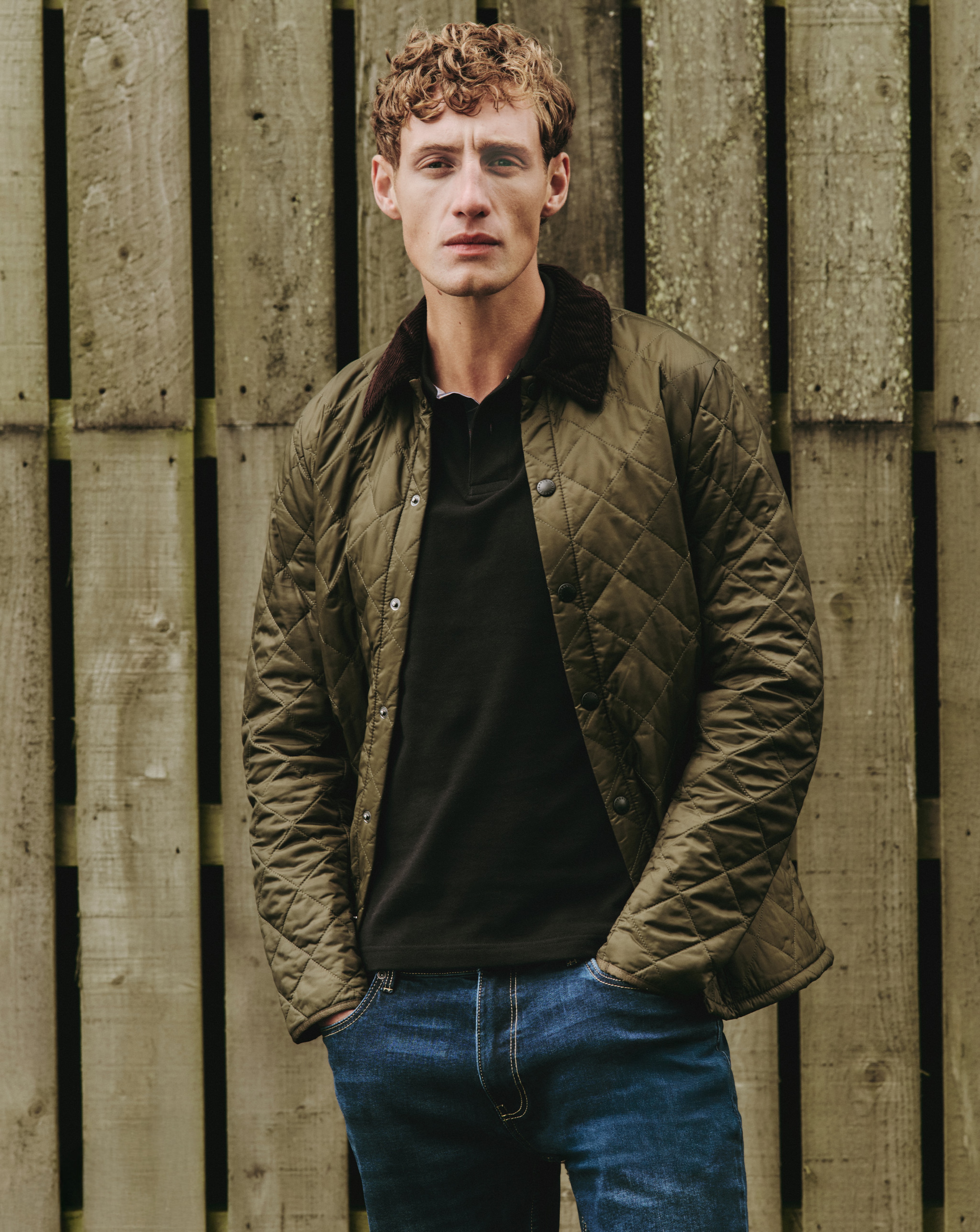 Model wearing a khaki quilted Barbour jacket